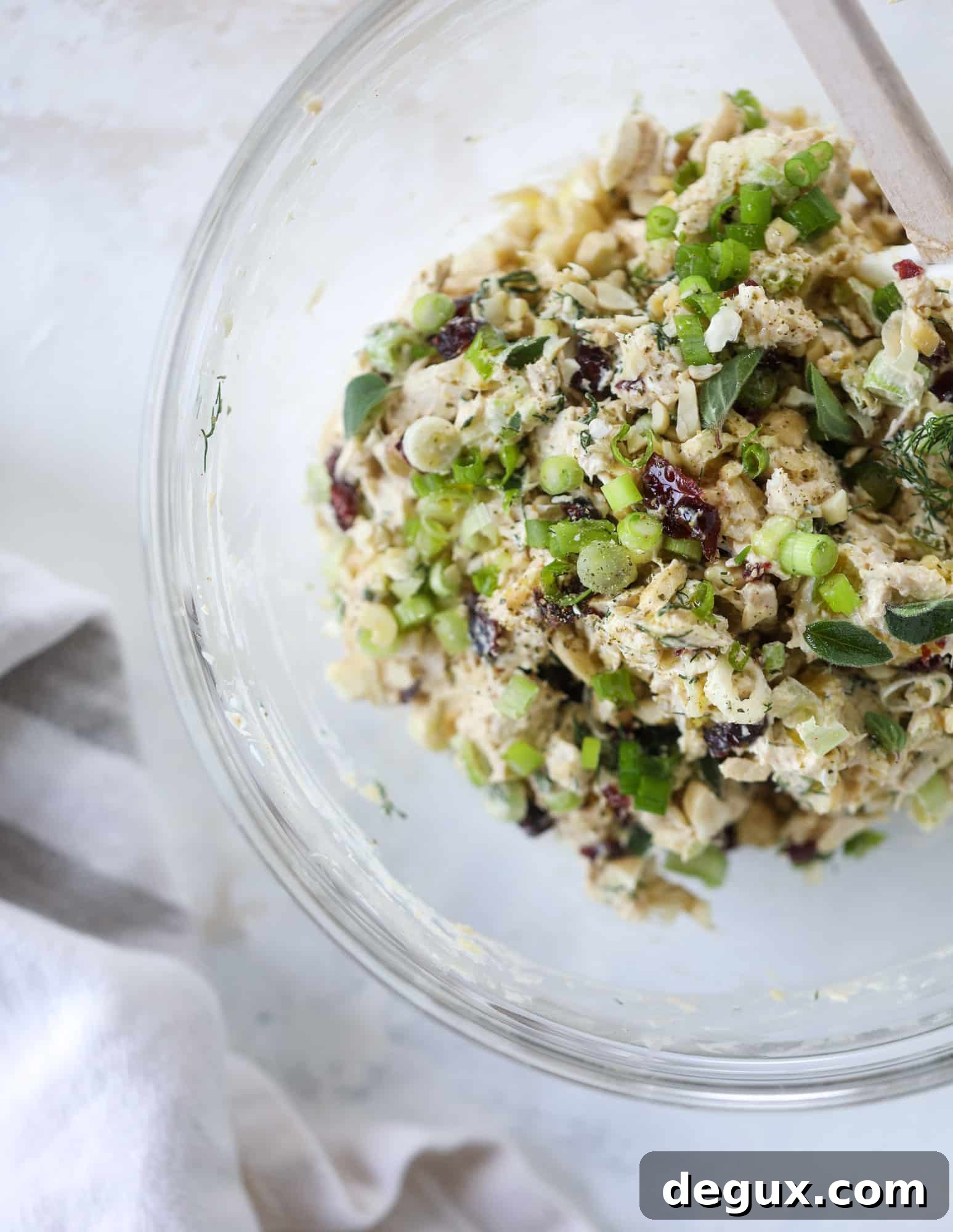 These smoky chicken salad stuffed avocados are lunchtime gold! They are super easy to throw together, satisfying and pretty darn great for you. Made with greek yogurt, some tangy mustard and dried cherries for sweetness, they are delish! I howsweeteats.com #chicken #salad #stuffed #avocados #greekyogurt