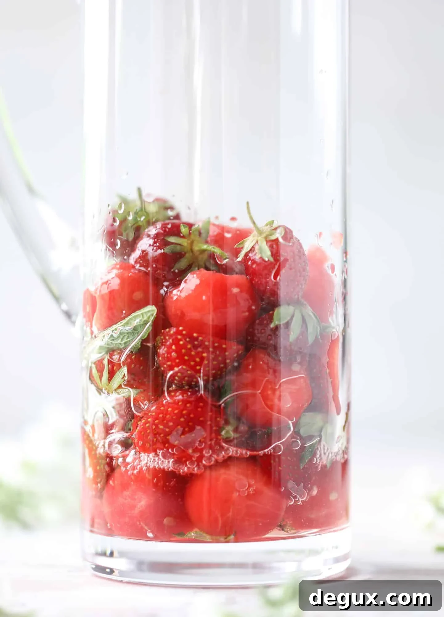 This spicy watermelon sangria is super refreshing, light, delicious and perfect for a hot summer day! Complete with an entire bottle of rosé, watermelon juice, melon balls, strawberries and brandy, this is the best summer cocktail in a pitcher! I howsweeteats.com #spicy #watermelon #sangria #cocktails #rosé