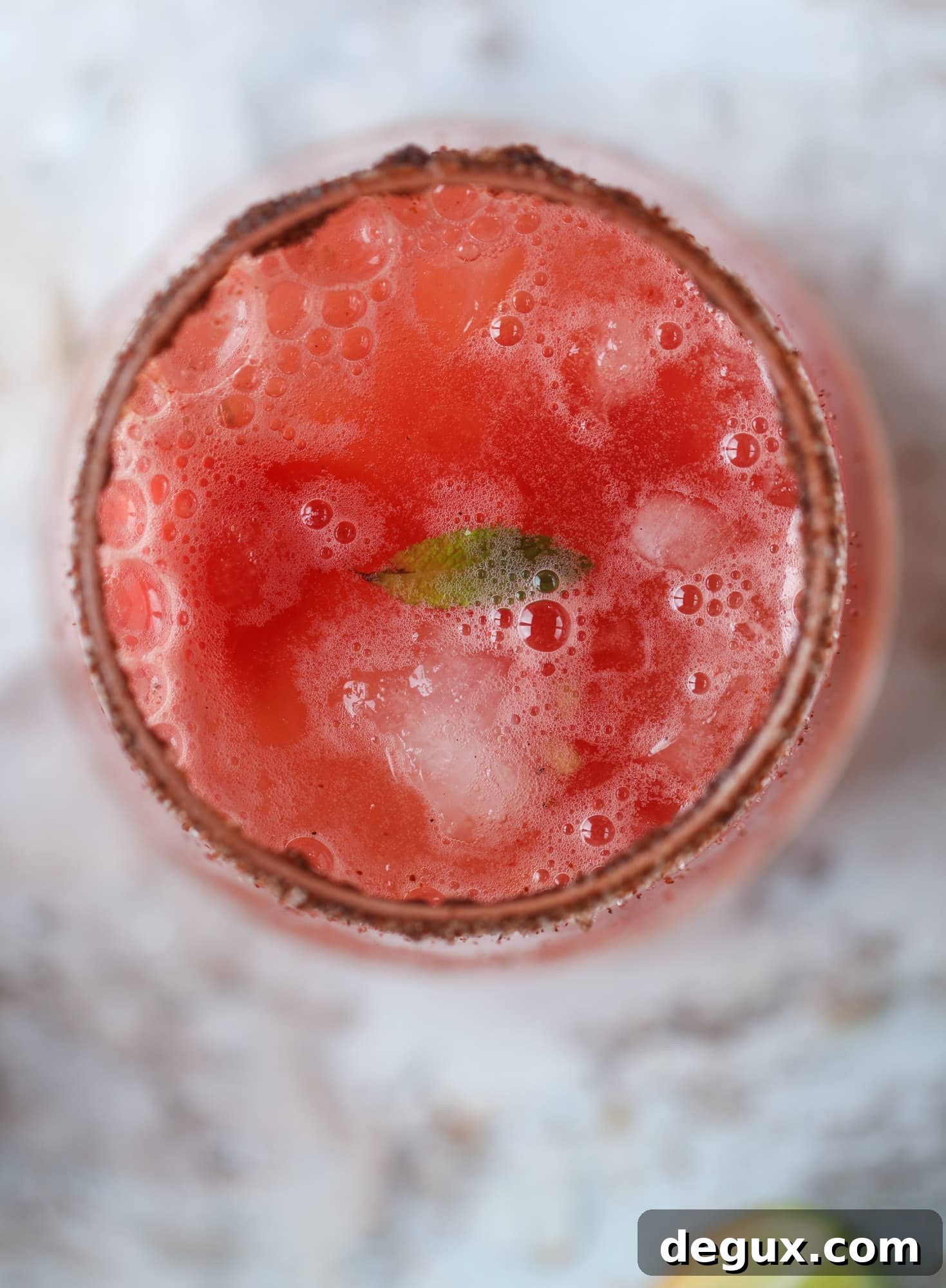 This spicy watermelon sangria is super refreshing, light, delicious and perfect for a hot summer day! Complete with an entire bottle of rosé, watermelon juice, melon balls, strawberries and brandy, this is the best summer cocktail in a pitcher! I howsweeteats.com #spicy #watermelon #sangria #cocktails #rosé