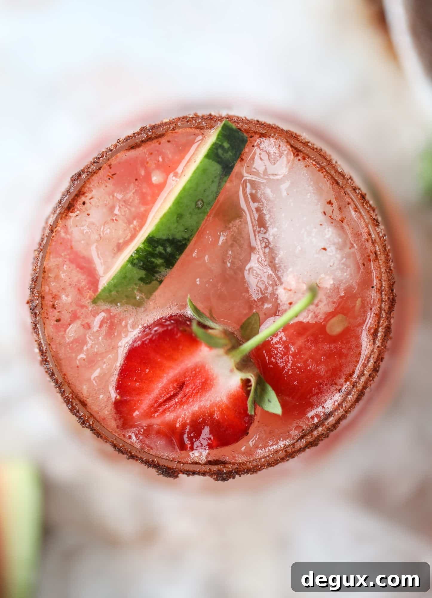This spicy watermelon sangria is super refreshing, light, delicious and perfect for a hot summer day! Complete with an entire bottle of rosé, watermelon juice, melon balls, strawberries and brandy, this is the best summer cocktail in a pitcher! I howsweeteats.com #spicy #watermelon #sangria #cocktails #rosé