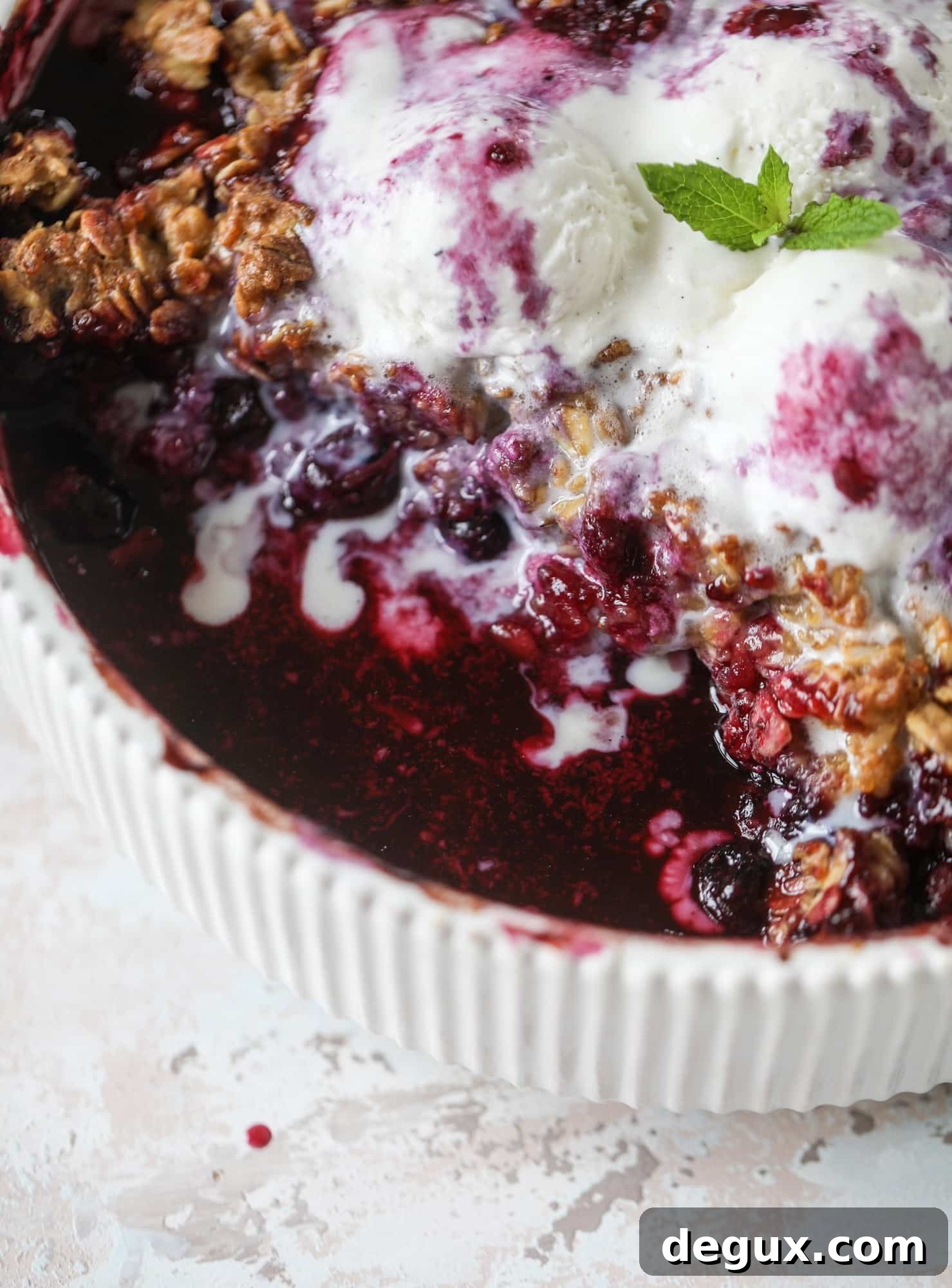 Blueberry Quinoa Cookie Crisp Recipe: Crunchy Fruit-Filled Treat 10 This blueberry crisp is warm and bursting with sweet and juicy fruit. It's topped with a quinoa oatmeal brown sugar topping and is the perfect dessert for summer. Served warm and topped with vanilla ice cream, it's just divine! I howsweeteats.com #blueberry #crisp #quinoa #oats #dessert #fruit