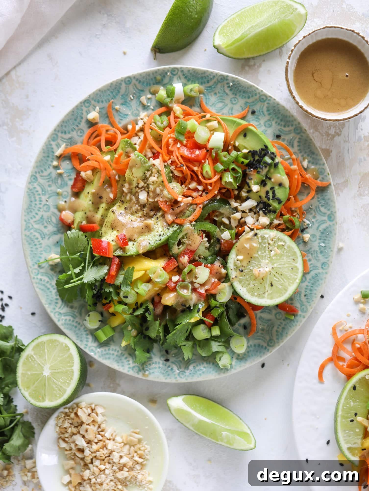20-Minute Thai Avocado Salad with Zesty Lime Dressing 2 This thai avocado salad is loaded with mango, red pepper, carrots, green onions and drizzled with a peanut butter vinaigrette. It's an amazing side salad or a fabulous dinner salad - add on chickpeas or shrimp or chicken if you wish! I howsweeteats.com #thai #avocado #salad #peanutbutter #mango #lime