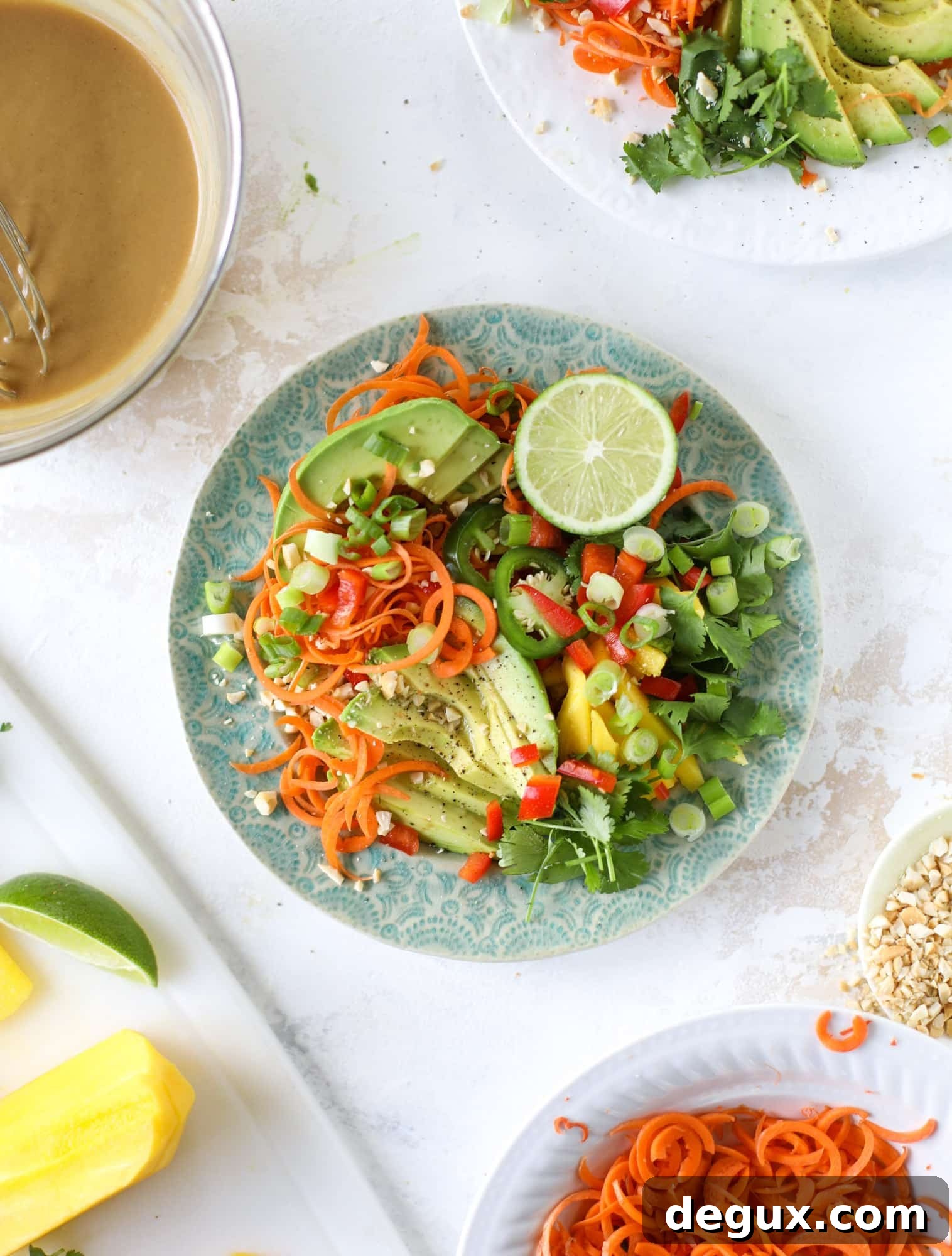 20-Minute Thai Avocado Salad with Zesty Lime Dressing 5 This thai avocado salad is loaded with mango, red pepper, carrots, green onions and drizzled with a peanut butter vinaigrette. It's an amazing side salad or a fabulous dinner salad - add on chickpeas or shrimp or chicken if you wish! I howsweeteats.com #thai #avocado #salad #peanutbutter #mango #lime