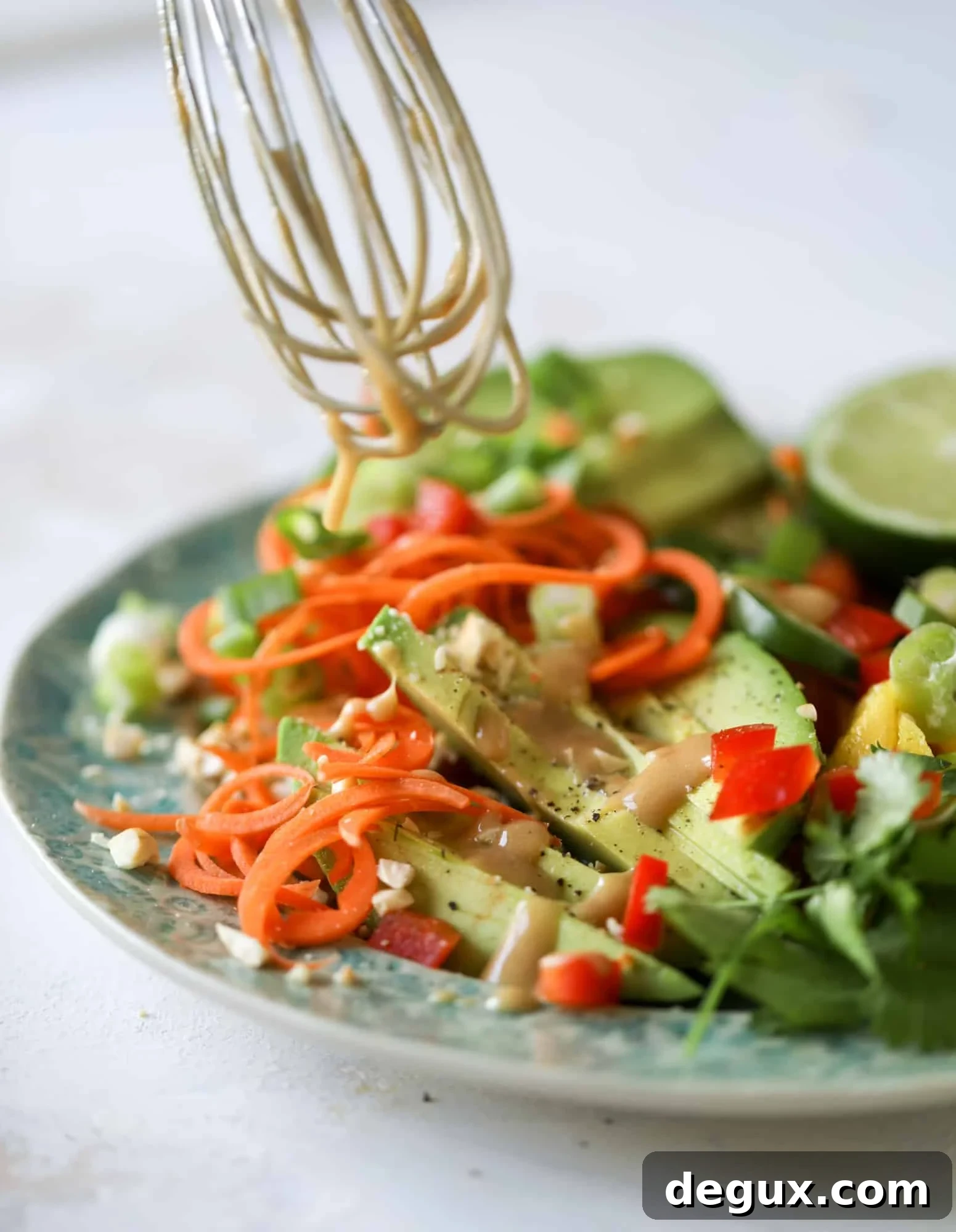 20-Minute Thai Avocado Salad with Zesty Lime Dressing 6 This thai avocado salad is loaded with mango, red pepper, carrots, green onions and drizzled with a peanut butter vinaigrette. It's an amazing side salad or a fabulous dinner salad - add on chickpeas or shrimp or chicken if you wish! I howsweeteats.com #thai #avocado #salad #peanutbutter #mango #lime