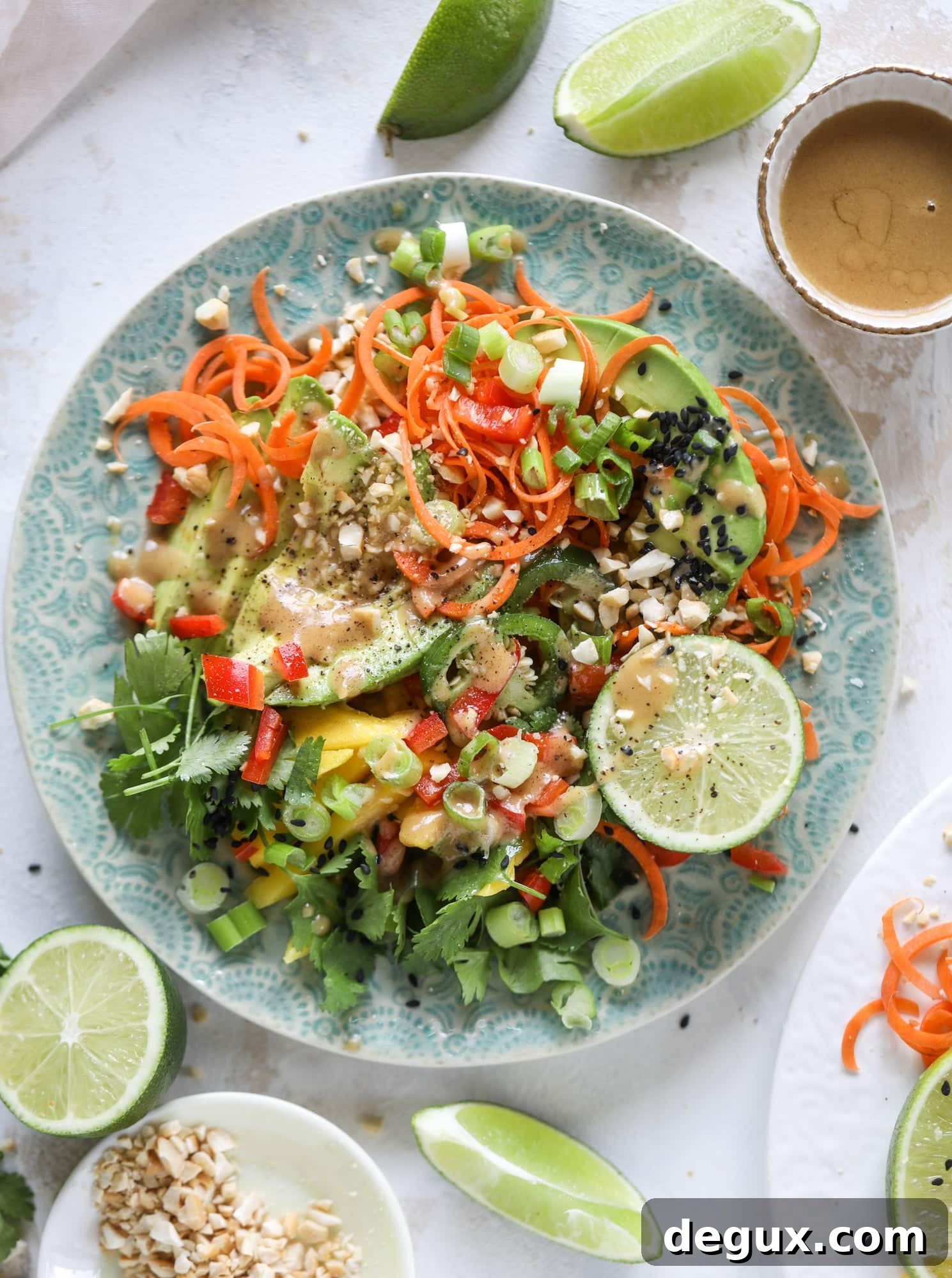 20-Minute Thai Avocado Salad with Zesty Lime Dressing 8 This thai avocado salad is loaded with mango, red pepper, carrots, green onions and drizzled with a peanut butter vinaigrette. It's an amazing side salad or a fabulous dinner salad - add on chickpeas or shrimp or chicken if you wish! I howsweeteats.com #thai #avocado #salad #peanutbutter #mango #lime