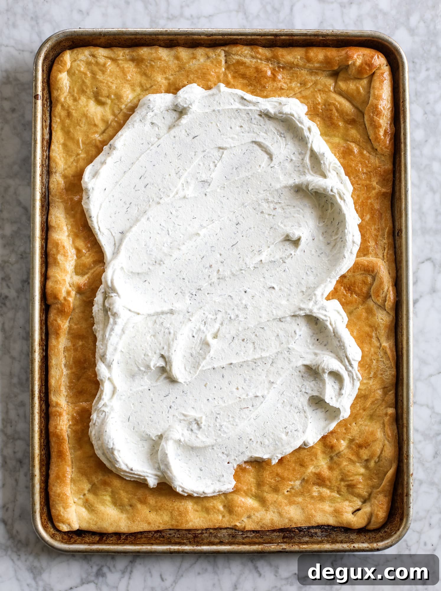 My mom's classic appetizer, the old school veggie pizza, is perfect for summer parties both indoor and out! A flaky pastry crust, a flavorful mascarpone greek yogurt base and tons of fresh chopped vegetables on top. It's a winning combination!