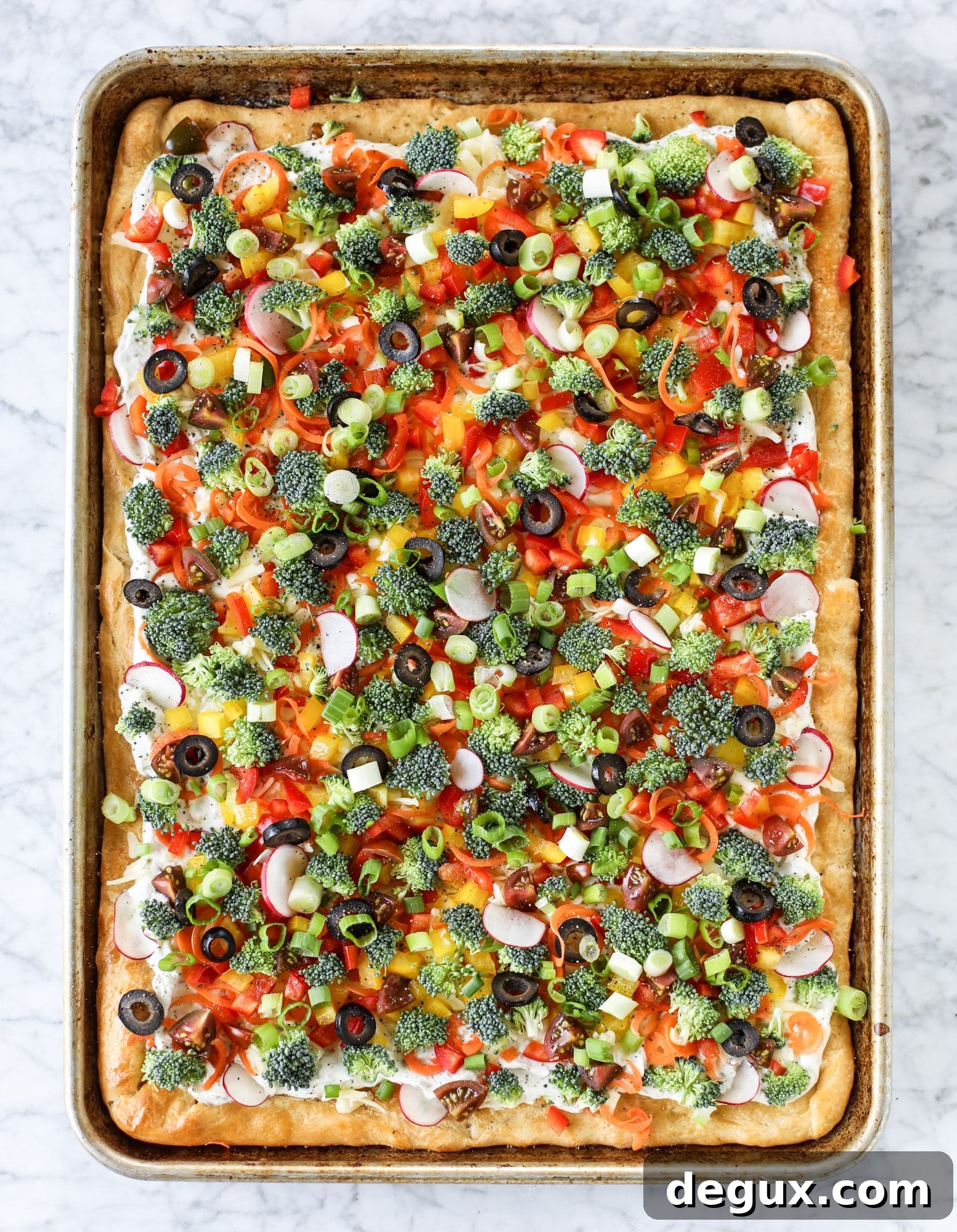 My mom's classic appetizer, the old school veggie pizza, is perfect for summer parties both indoor and out! A flaky pastry crust, a flavorful mascarpone greek yogurt base and tons of fresh chopped vegetables on top. It's a winning combination!