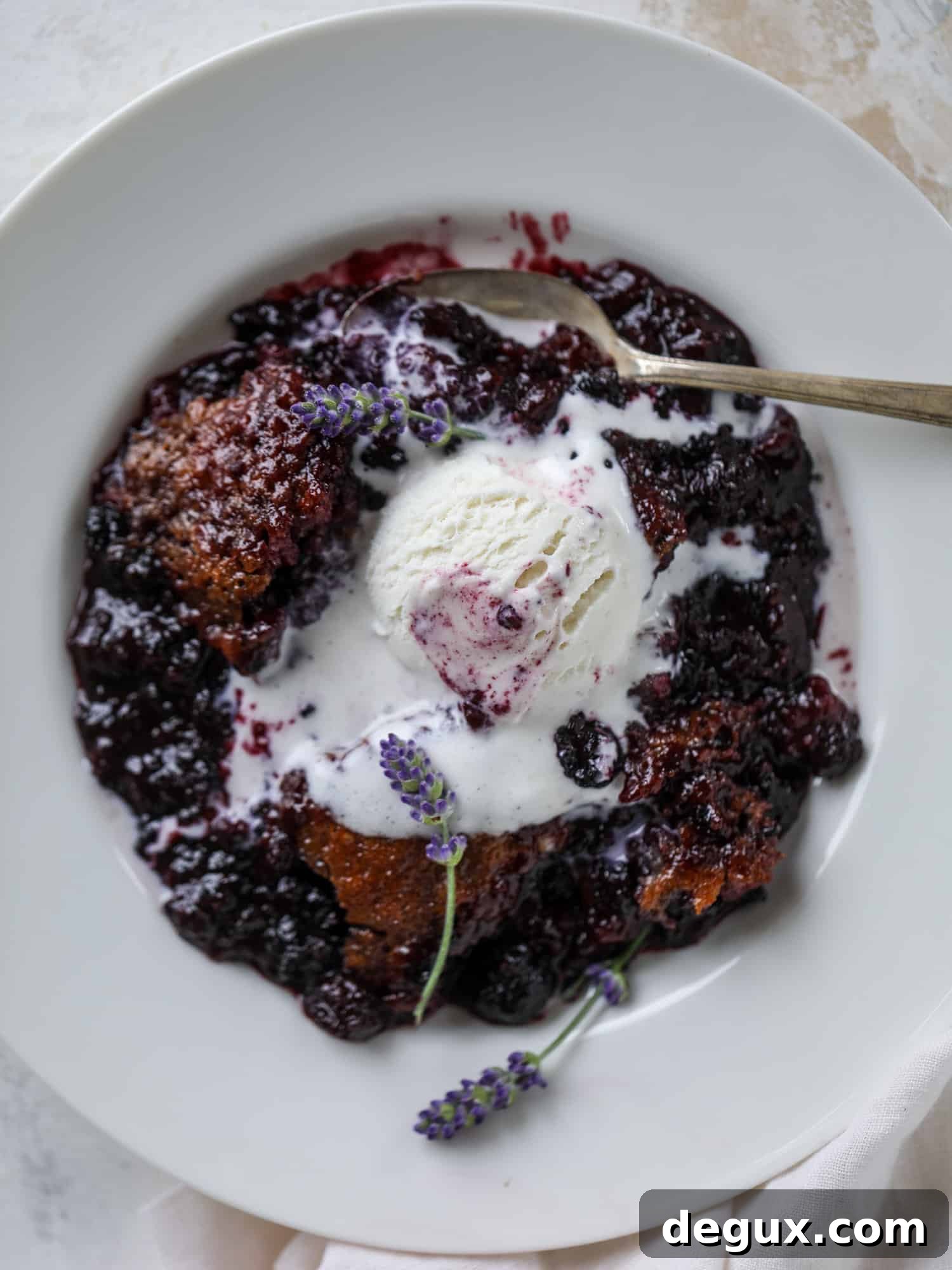 Black Raspberry and Lavender Cobbler Recipe for Summer Desserts 8 This black raspberry cobbler is a summer dream come true! The bursting black raspberries are rich and sweet, then add in a touch of lavender for incredible flavor and you're all set. The cobbler cake topping is perfect for vanilla ice cream. Win! I howsweeteats.com #black #raspberry #cobbler #lavender #summer #desserts #icecream