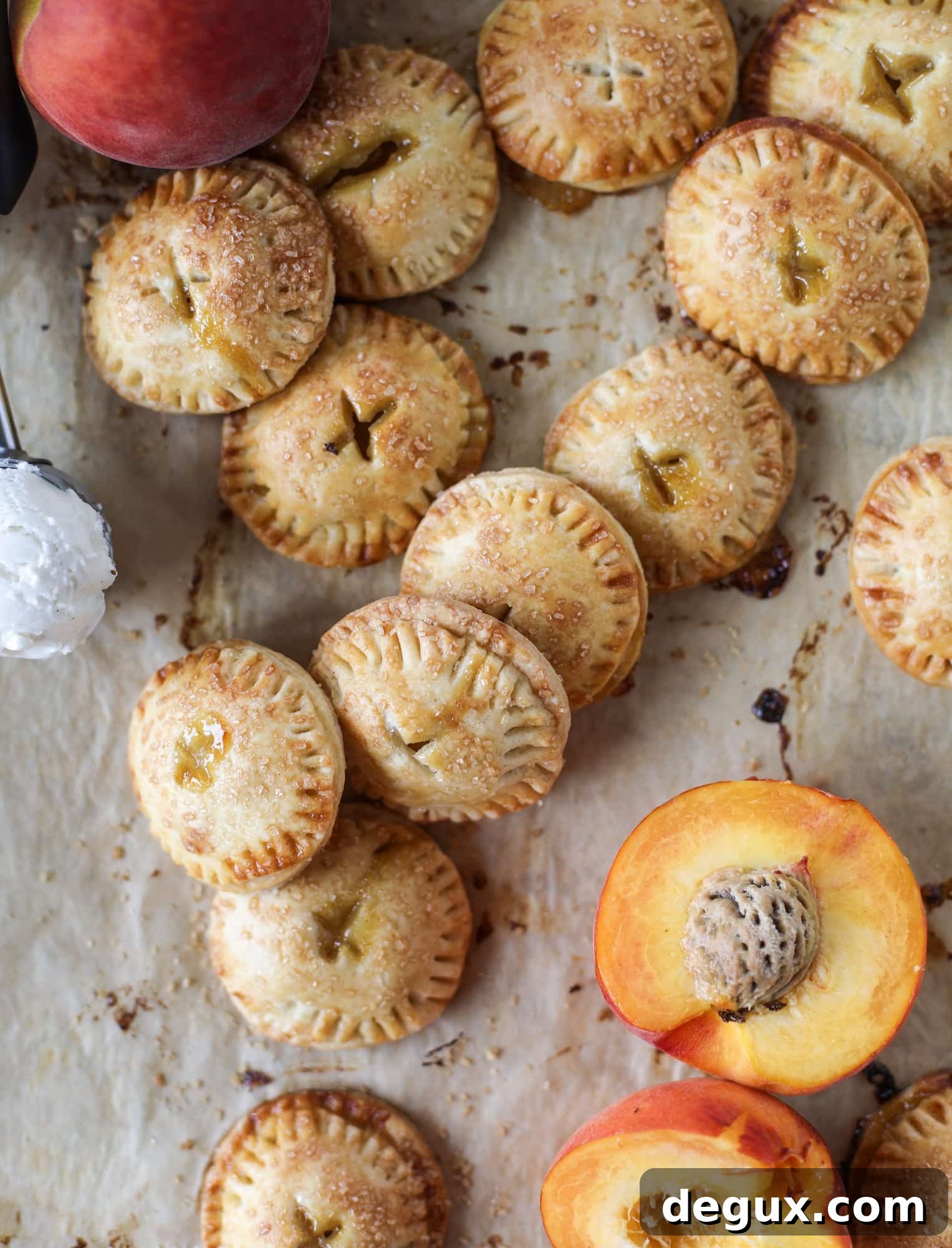 These little peach hand pies are super easy to make and oh-so delicious for summer! A warm and syrupy homemade peach filling made with brown sugar and bourbon, stuck inside a flakey all-butter crust and sprinkled with coarse sugar. SO GOOD. I howsweeteats.com #peach #hand #pies #mini #dessert #summer