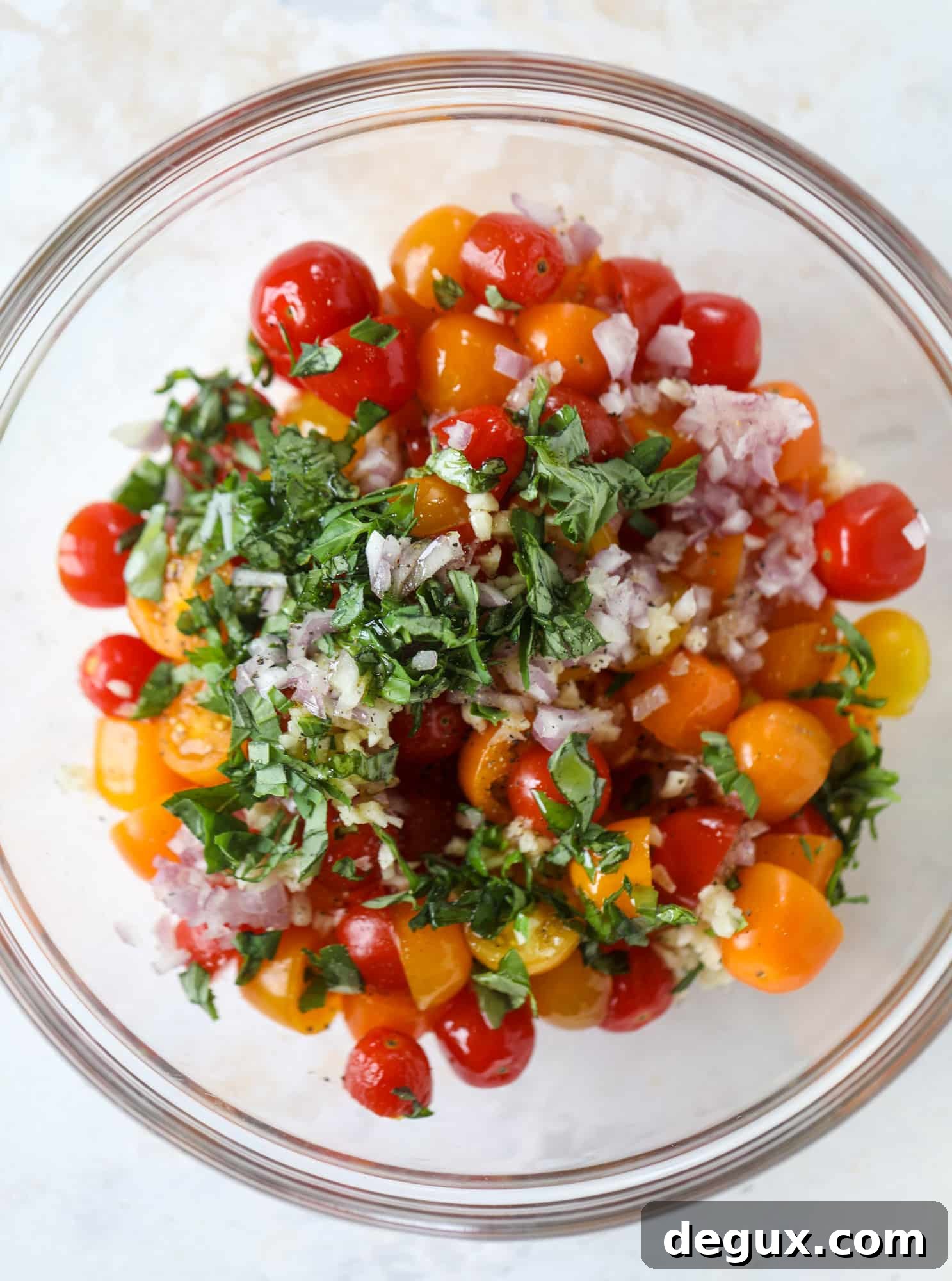 This bruschetta chicken is the perfect summer garden meal! Juicy, flavorful chicken topped with fresh tomatoes, garlic, basil and balsamic glaze, along with a touch of cheese. Served with pasta, it's an incredible meal. I howsweeteats.com #bruschetta #chicken #pasta #tomatoes #basil 