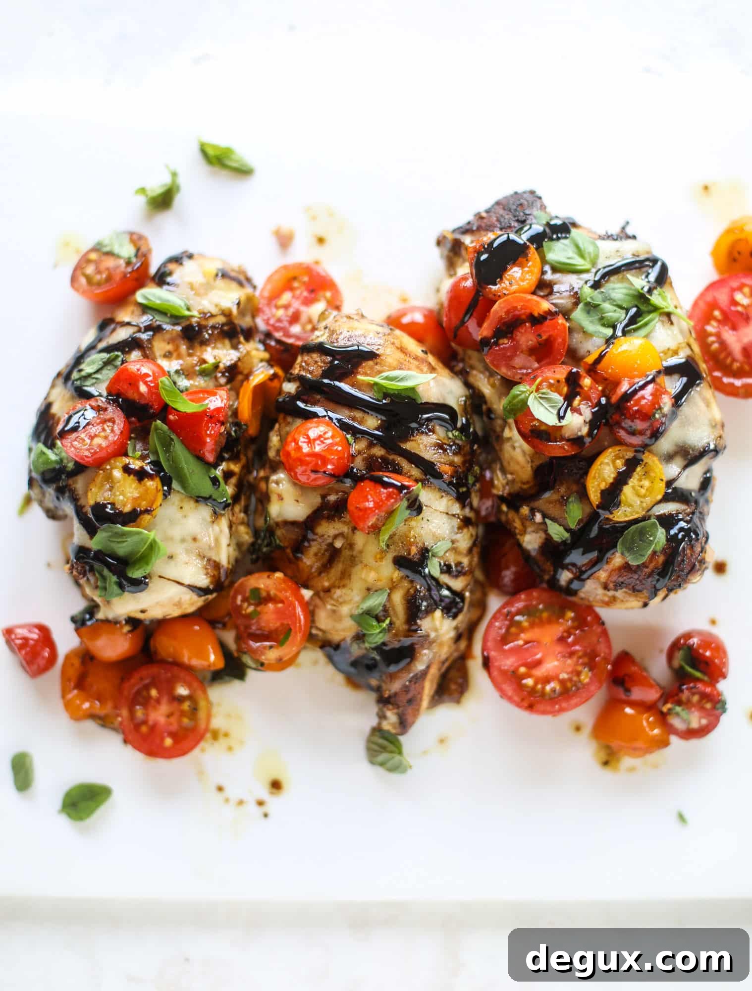 This bruschetta chicken is the perfect summer garden meal! Juicy, flavorful chicken topped with fresh tomatoes, garlic, basil and balsamic glaze, along with a touch of cheese. Served with pasta, it's an incredible meal. I howsweeteats.com #bruschetta #chicken #pasta #tomatoes #basil 