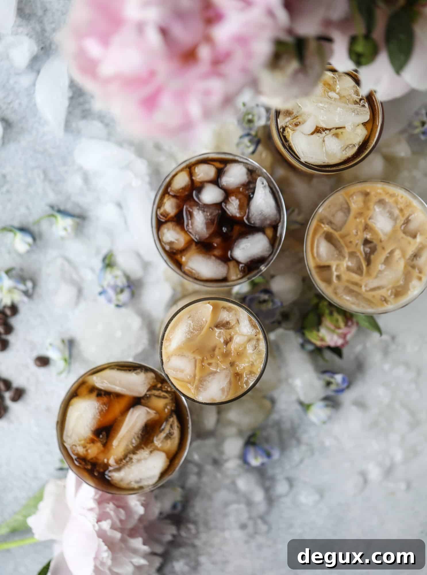 Sparkling Coconut Iced Coffee Recipe: Refreshing Summer Drink 5 A glass of iced coffee soda topped with coconut cream.