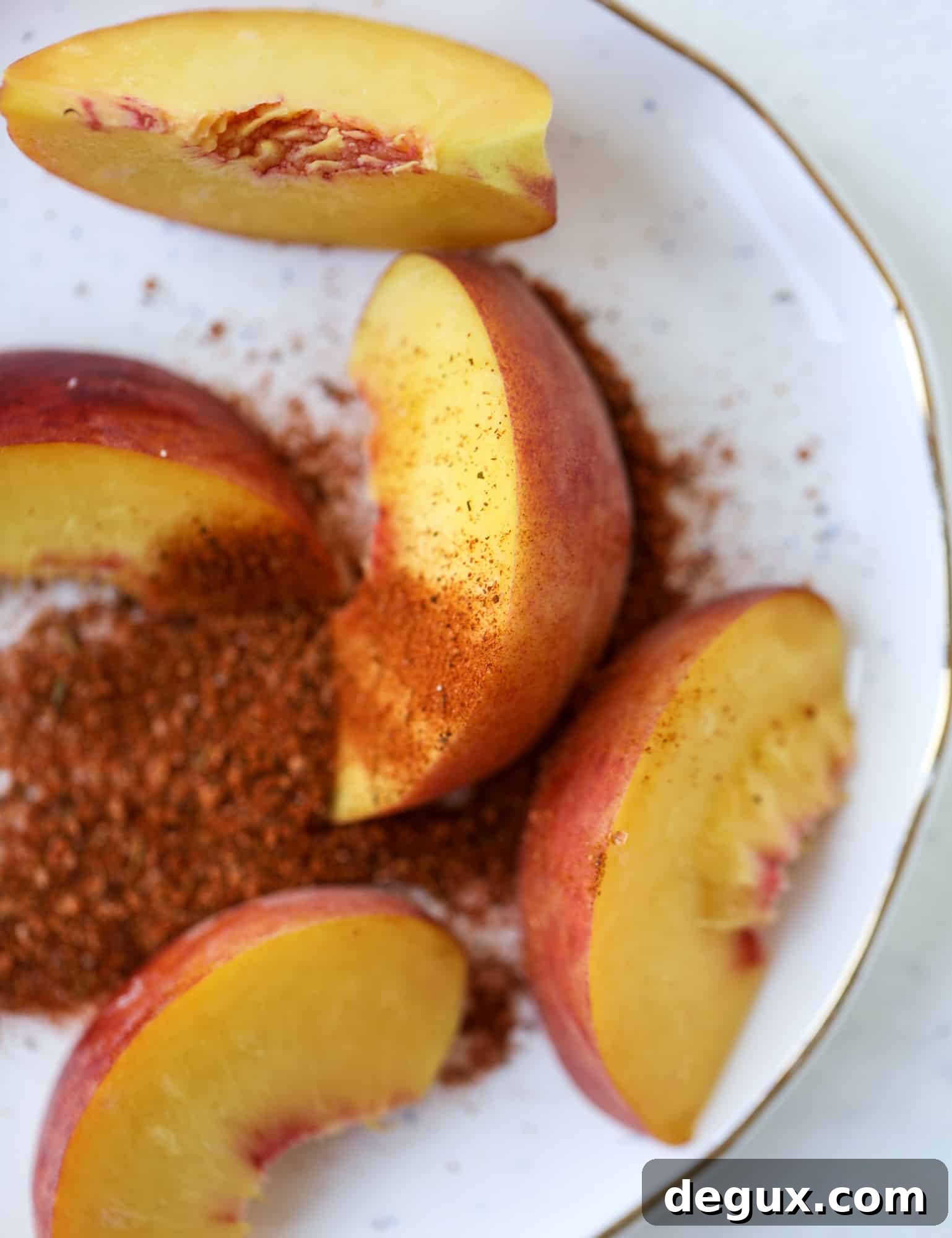 Cajun Peach Lemonade Recipe: Spicy-Sweet Southern Drink 3 This peach lemonade is super refreshing and a bit spicy for a hot and sunny summer day. It's sweet and fresh and the rim is dipped in a cajun seasoning, bringing the best bite of heat to this perfect summer drink. So fresh! I howsweeteats.com #peach #lemonade #cajun #summer #mocktail #lemon #drink