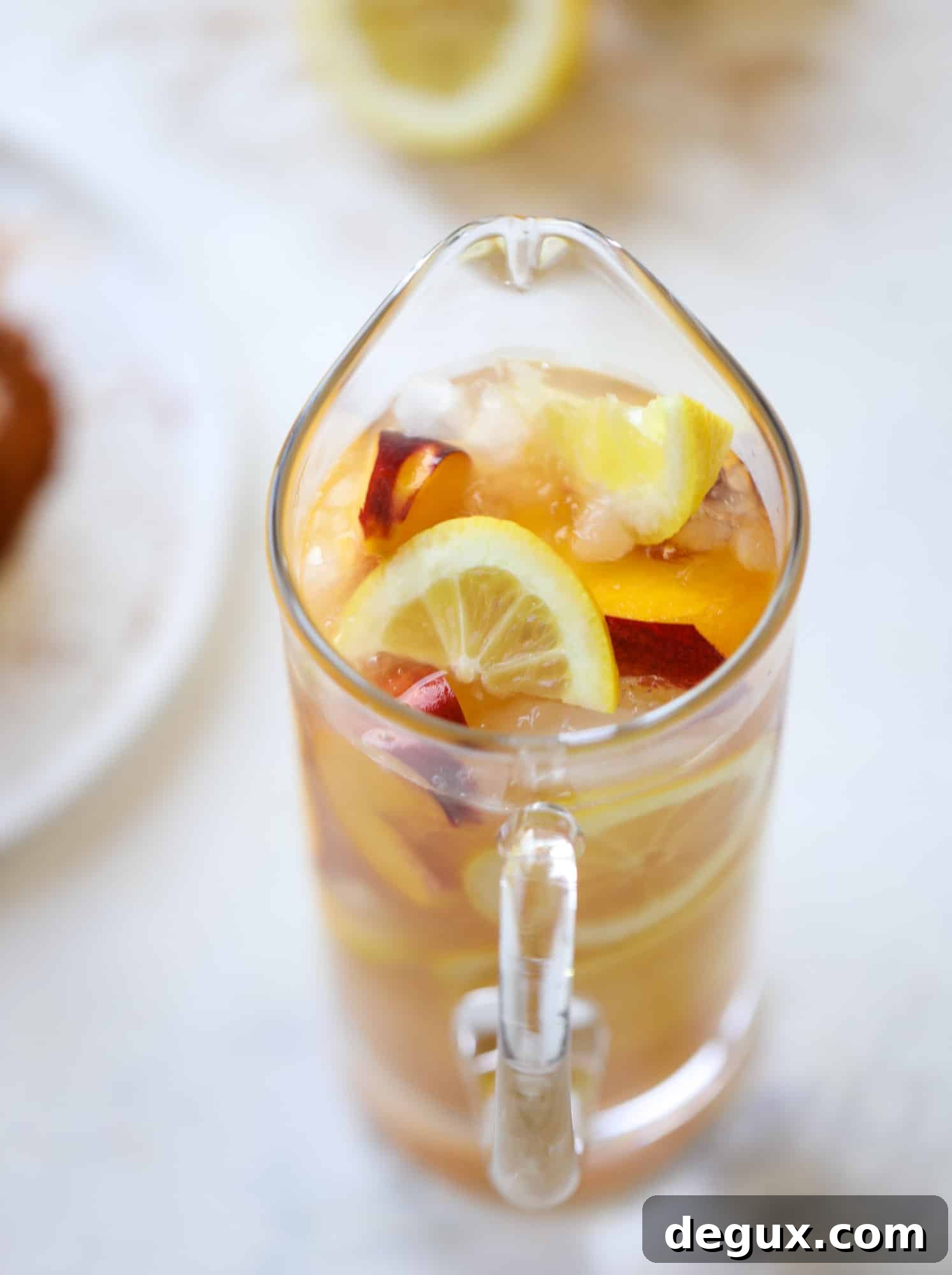 Cajun Peach Lemonade Recipe: Spicy-Sweet Southern Drink 4 This peach lemonade is super refreshing and a bit spicy for a hot and sunny summer day. It's sweet and fresh and the rim is dipped in a cajun seasoning, bringing the best bite of heat to this perfect summer drink. So fresh! I howsweeteats.com #peach #lemonade #cajun #summer #mocktail #lemon #drink