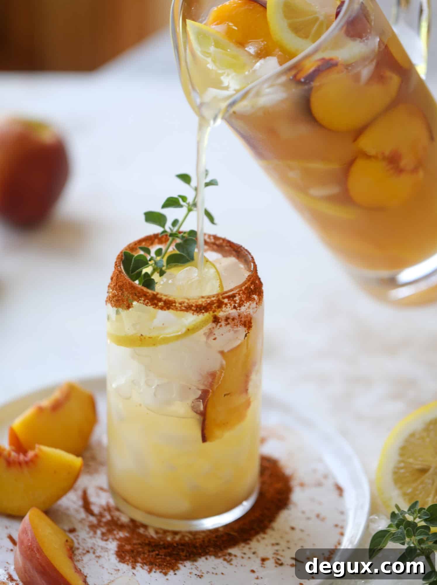 Cajun Peach Lemonade Recipe: Spicy-Sweet Southern Drink 5 This peach lemonade is super refreshing and a bit spicy for a hot and sunny summer day. It's sweet and fresh and the rim is dipped in a cajun seasoning, bringing the best bite of heat to this perfect summer drink. So fresh! I howsweeteats.com #peach #lemonade #cajun #summer #mocktail #lemon #drink