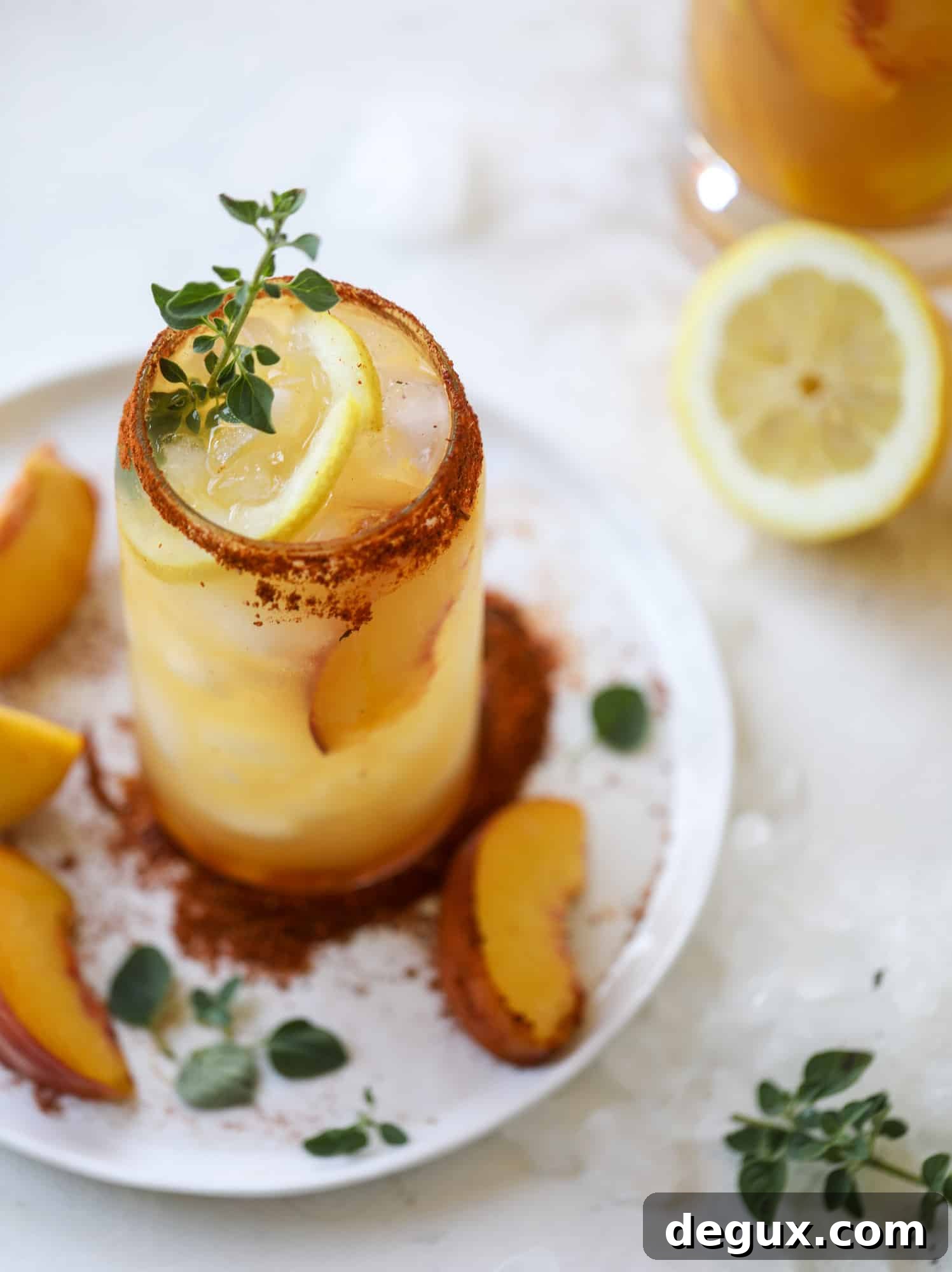 Cajun Peach Lemonade Recipe: Spicy-Sweet Southern Drink 6 This peach lemonade is super refreshing and a bit spicy for a hot and sunny summer day. It's sweet and fresh and the rim is dipped in a cajun seasoning, bringing the best bite of heat to this perfect summer drink. So fresh! I howsweeteats.com #peach #lemonade #cajun #summer #mocktail #lemon #drink