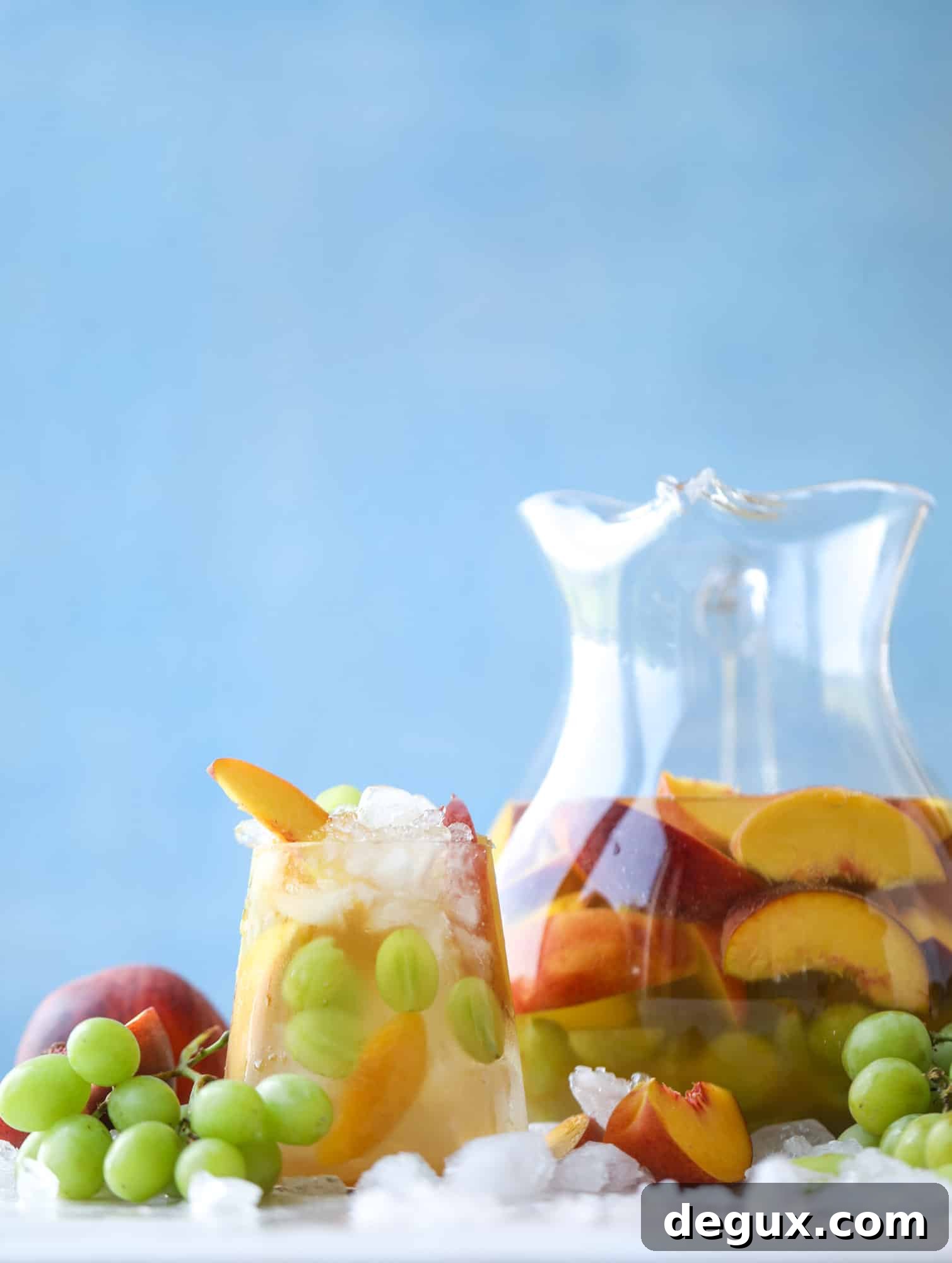 Pinot grigio sangria with peach nectar, fresh and frozen peach slices, brandy and bubbles.