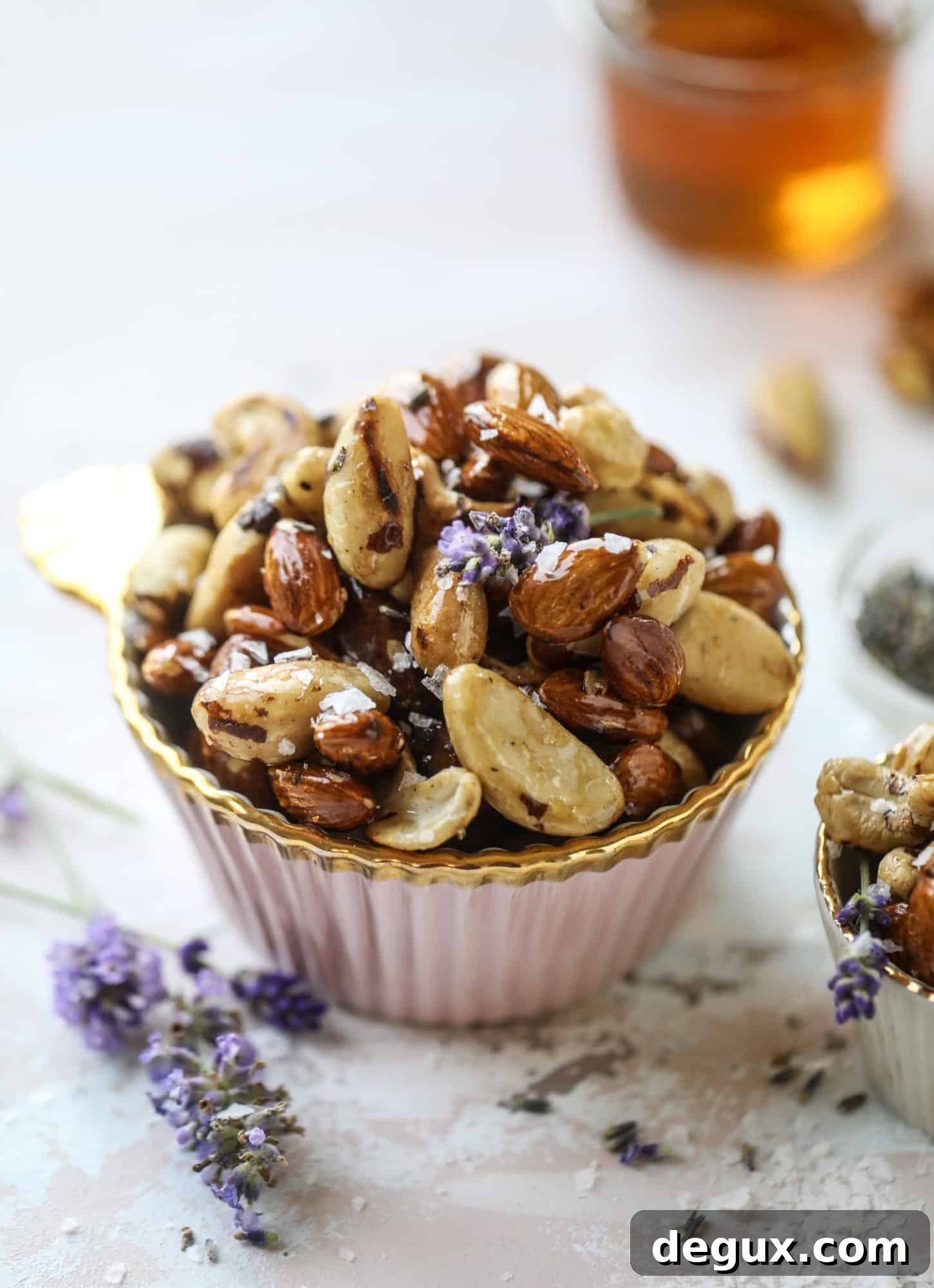 These salted honey lavender nuts are the best snack to make for when you're on the go or when you need a perfect appetizer for your dinner party. Roasted, sweet and salty with a hint of lavender makes these irresistible!
