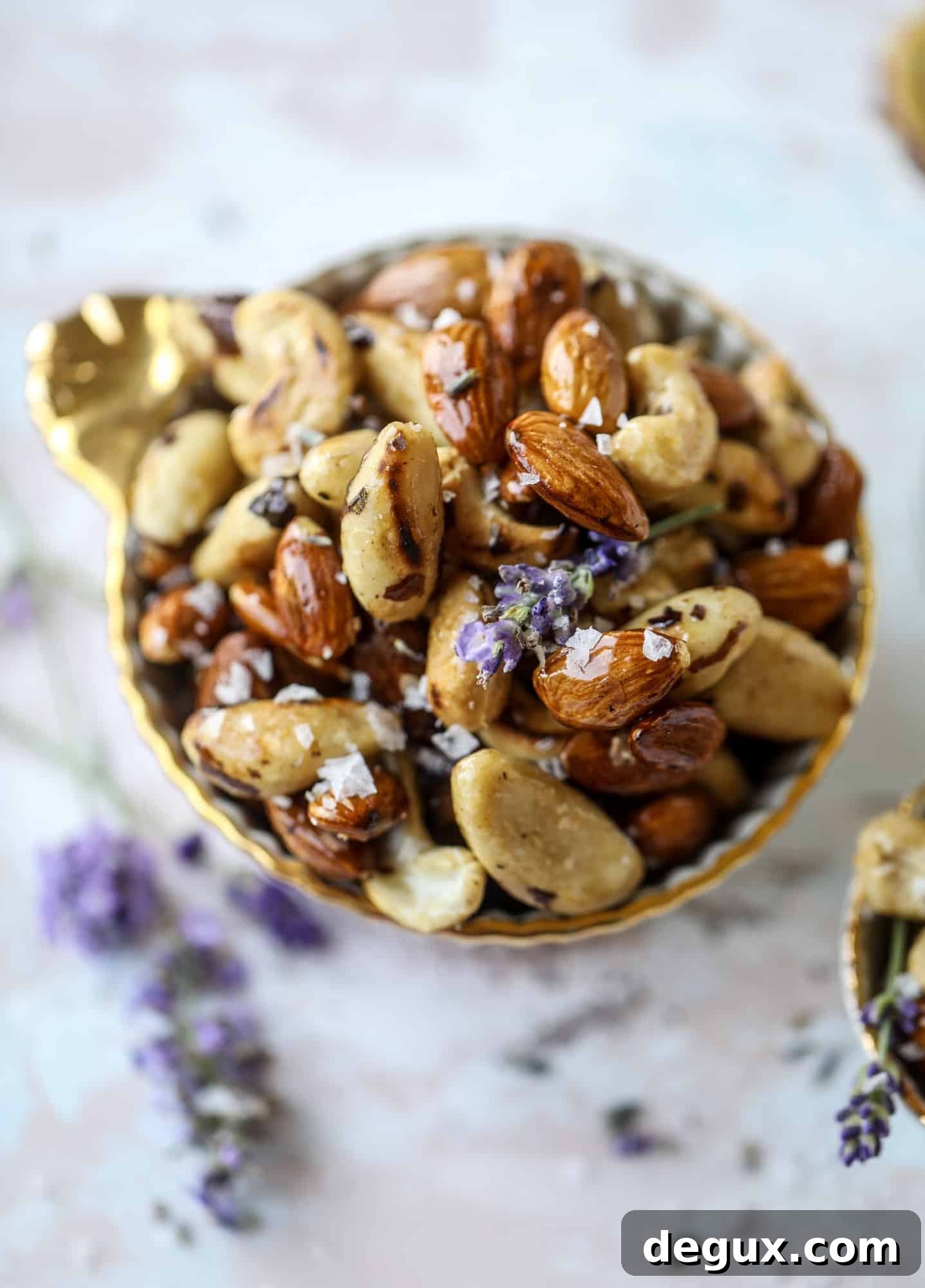 These salted honey lavender nuts are the best snack to make for when you're on the go or when you need a perfect appetizer for your dinner party. Roasted, sweet and salty with a hint of lavender makes these irresistible!