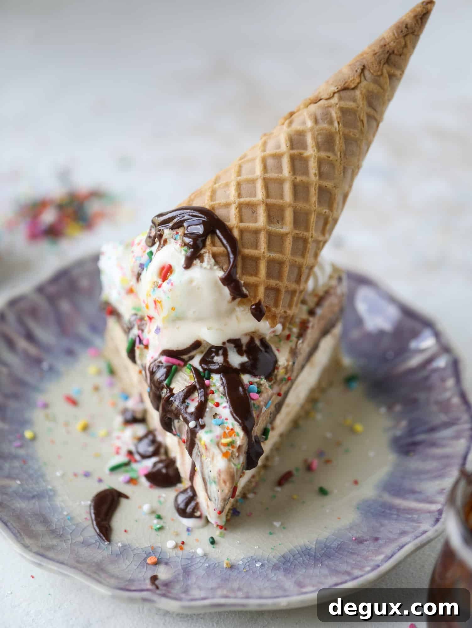 Peanut Butter Fudge Ice Cream Cake Recipe — Creamy Layered Dessert 2 Peanut butter fudge ice cream cake with pretzel crust, vanilla ice cream, hot fudge and peanut butter whipped cream