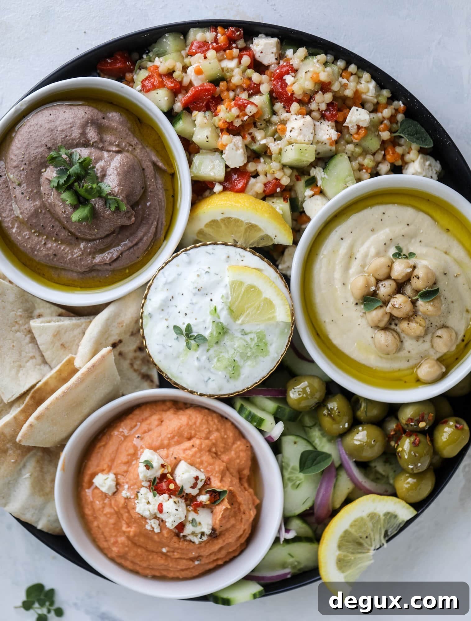Couscous salad and tzatziki on a platter