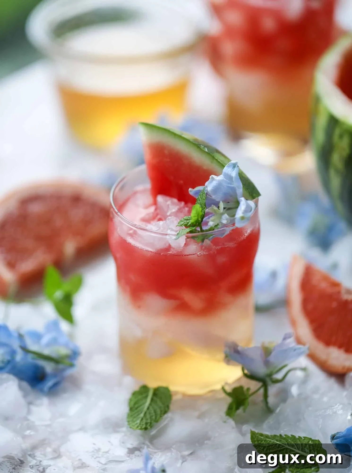 This watermelon grapefruit paloma cocktail is a summertime dream! Grapefruit syrup is super easy to make and when it's combined with fresh watermelon juice and tequila... oooh! Best happy hour ever. I howsweeteats.com #grapefruit #watermelon #paloma #cocktail #tequila