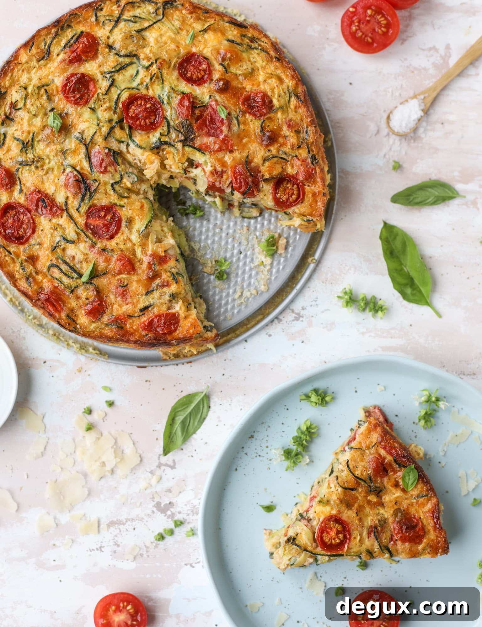 This zucchini pie recipes is absolutely divine and perfect for breakfast or dinner! Completely with garlic and blistered tomatoes, it combines cheese and egg to make a to-die-for frittata-like dish that can be eaten hot or cold! I howsweeteats.com #zucchini #pie #tomatoes #eggs #recipes #garden #summer