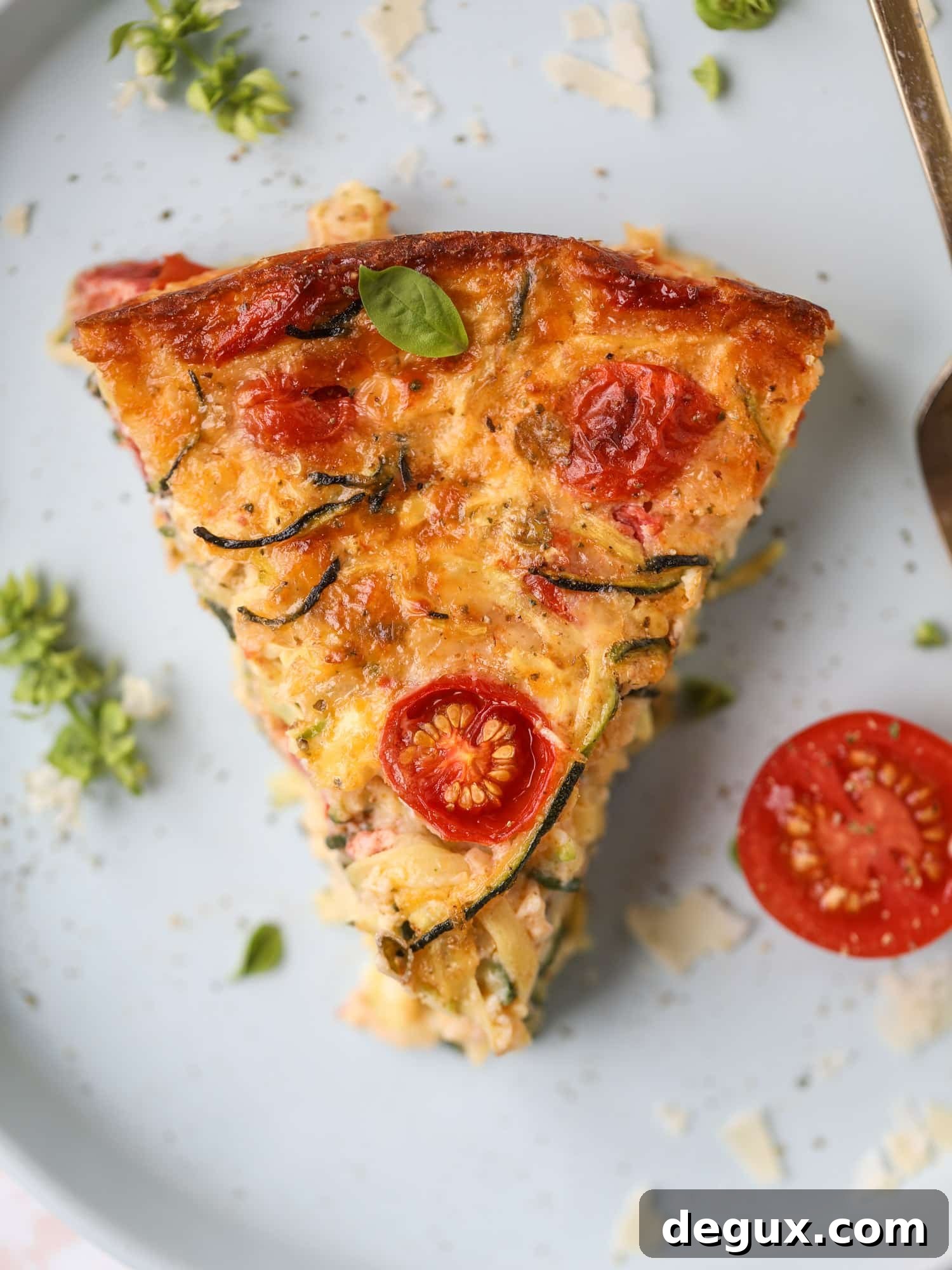 This zucchini pie recipes is absolutely divine and perfect for breakfast or dinner! Completely with garlic and blistered tomatoes, it combines cheese and egg to make a to-die-for frittata-like dish that can be eaten hot or cold! I howsweeteats.com #zucchini #pie #tomatoes #eggs #recipes #garden #summer
