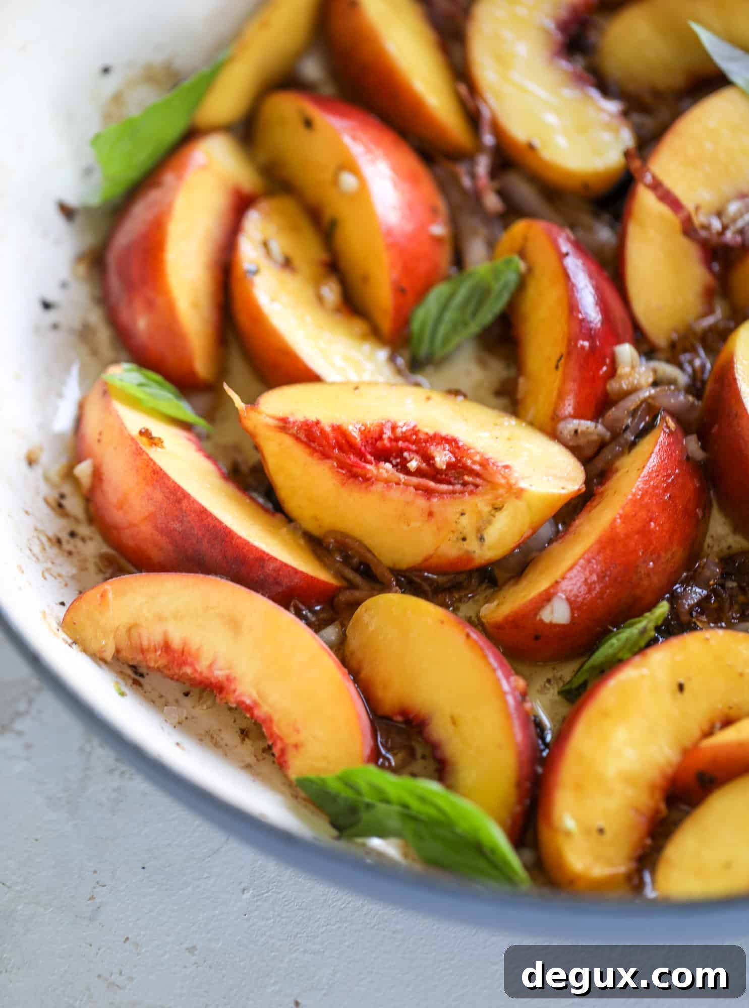One-Pan Peach and Basil Chicken Skillet Recipe 3 This amazing summertime one pot chicken is made with fresh peaches and basil and takes no time at all. The sweet and savory combination is perfect for a quick weeknight meal; the sauce is amazing for dipping and the chicken is flavorful as can be. I howsweeteats.com #chicken #peach #basil #easy #dinner #recipe #summer #healthy