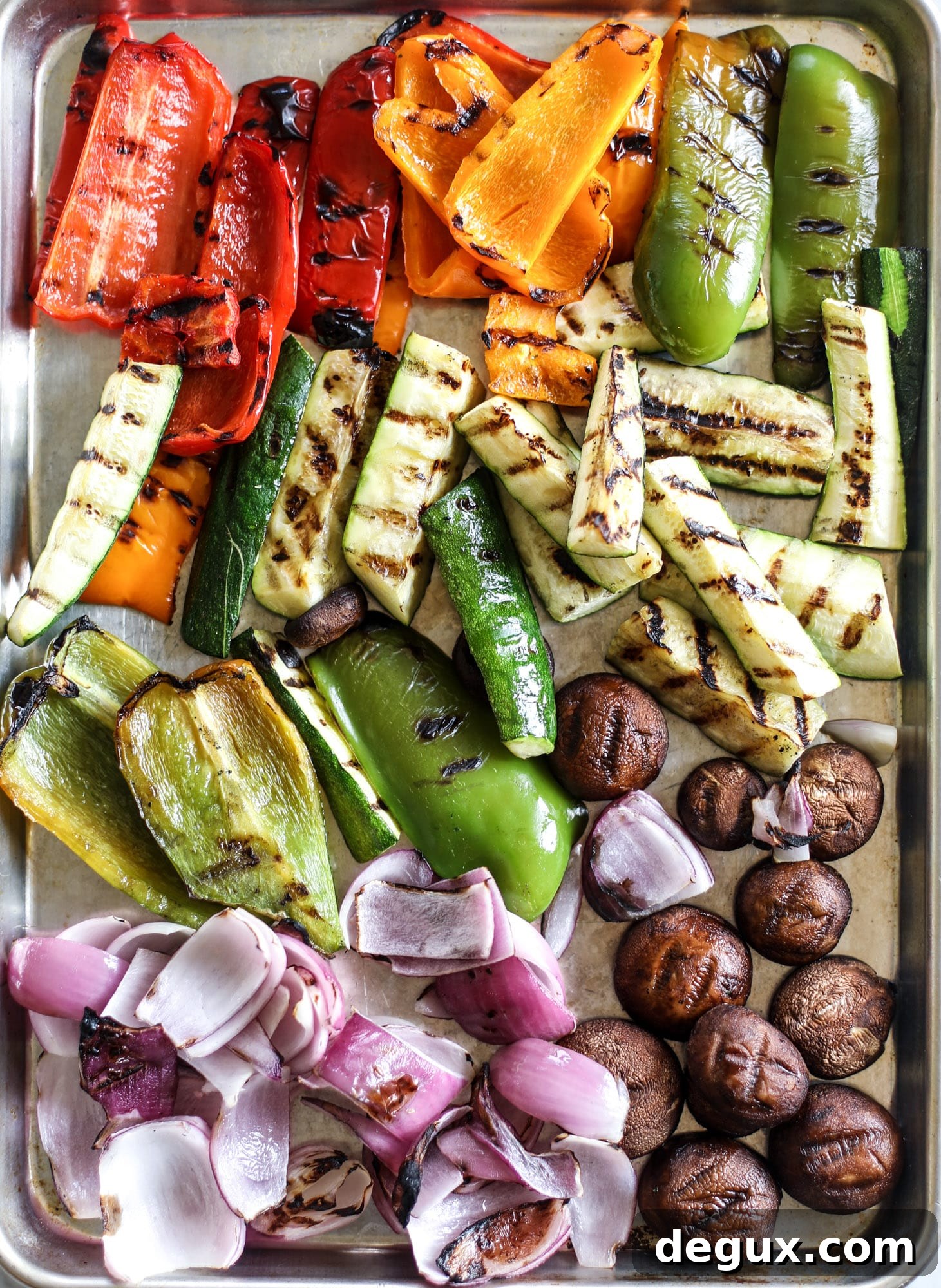 These are the best grilled vegetables ever! You grill your veggies and chop them into the perfect bite, then drizzle them with a fabulous fresh basil vinaigrette. Delish! It doesn't end there; serve these with grilled garlic toast and everyone will freak! I howsweeteats.com #best #grilled #vegetables #veggies #basil #bread