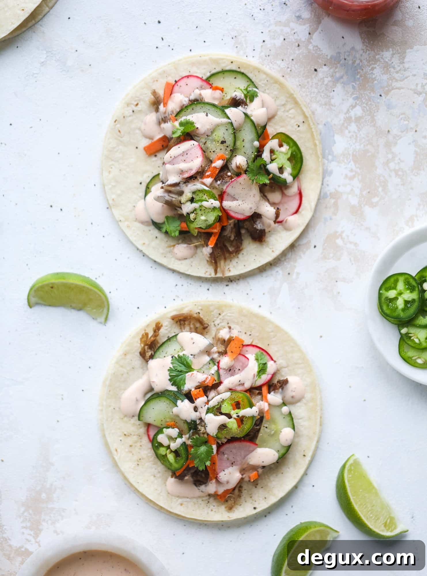 Banh Mi Tacos: Vietnamese Sandwich Flavors in Soft Tortillas 2 These bahn mi tacos are the perfect twist on the classic sandwich! Juicy pulled pork, pickled veggies, a tangy crema and loads of flavor. Bahn mi tacos are a delish weeknight meal or also work great if you have pork leftovers! I howsweeteats.com #bahn #mi #tacos #pork #dinner