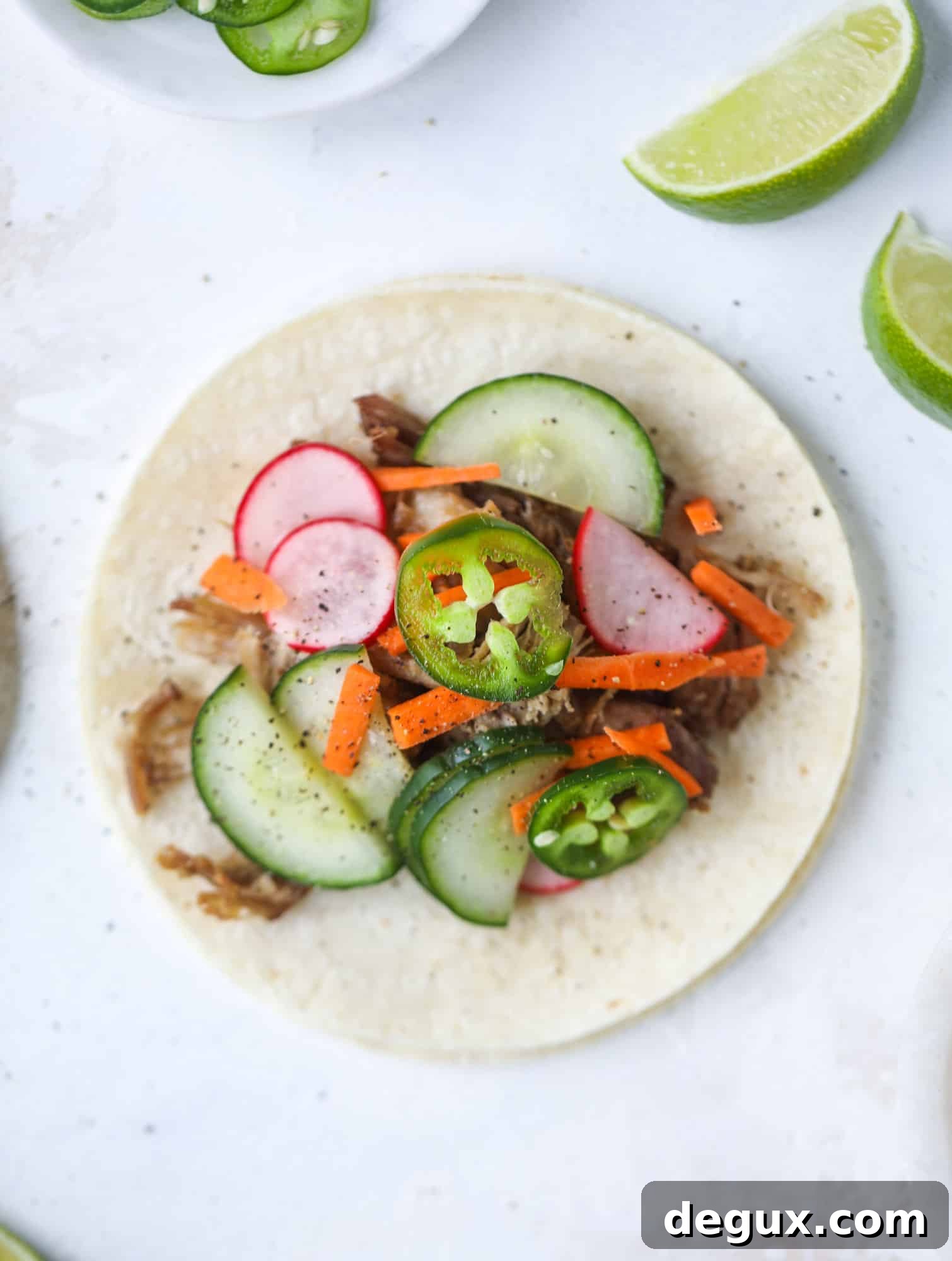 Banh Mi Tacos: Vietnamese Sandwich Flavors in Soft Tortillas 4 These bahn mi tacos are the perfect twist on the classic sandwich! Juicy pulled pork, pickled veggies, a tangy crema and loads of flavor. Bahn mi tacos are a delish weeknight meal or also work great if you have pork leftovers! I howsweeteats.com #bahn #mi #tacos #pork #dinner