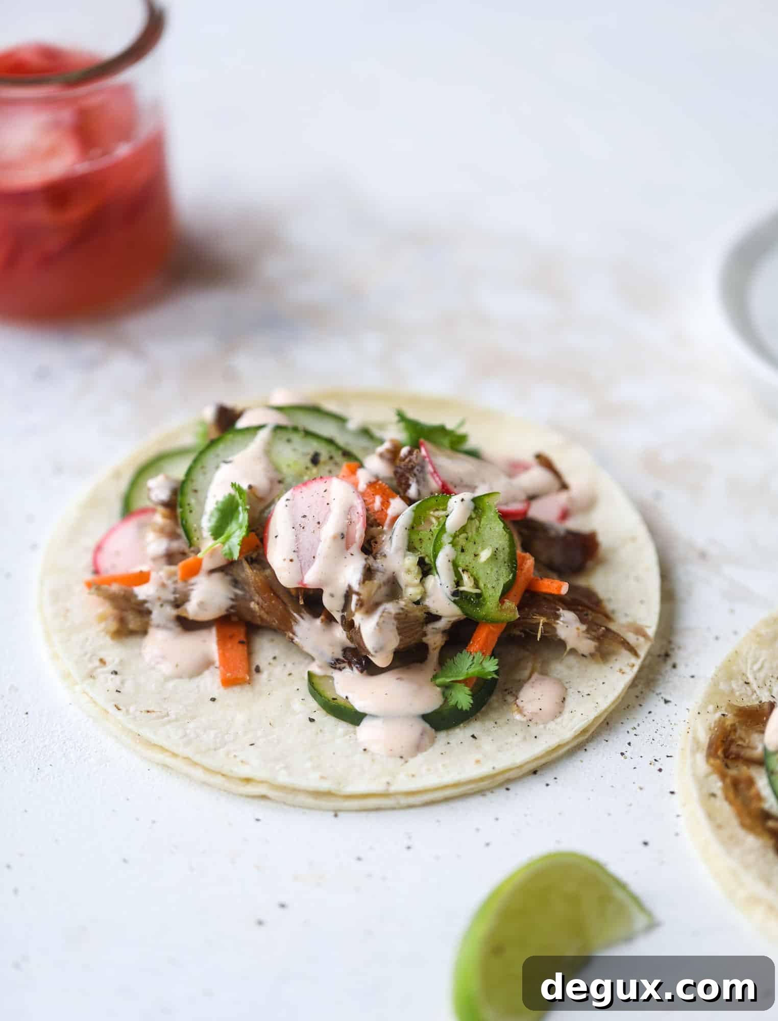 Banh Mi Tacos: Vietnamese Sandwich Flavors in Soft Tortillas 5 These bahn mi tacos are the perfect twist on the classic sandwich! Juicy pulled pork, pickled veggies, a tangy crema and loads of flavor. Bahn mi tacos are a delish weeknight meal or also work great if you have pork leftovers! I howsweeteats.com #bahn #mi #tacos #pork #dinner