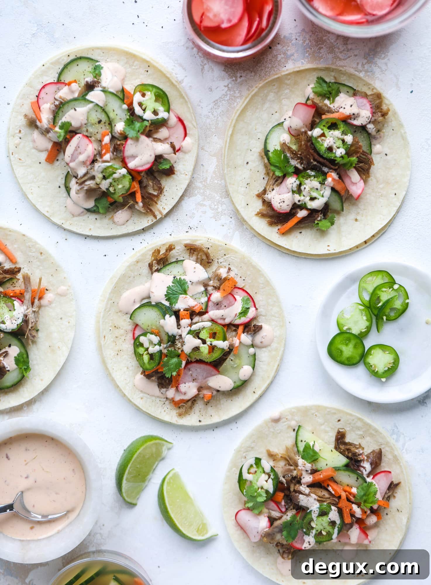 Banh Mi Tacos: Vietnamese Sandwich Flavors in Soft Tortillas 6 These bahn mi tacos are the perfect twist on the classic sandwich! Juicy pulled pork, pickled veggies, a tangy crema and loads of flavor. Bahn mi tacos are a delish weeknight meal or also work great if you have pork leftovers! I howsweeteats.com #bahn #mi #tacos #pork #dinner