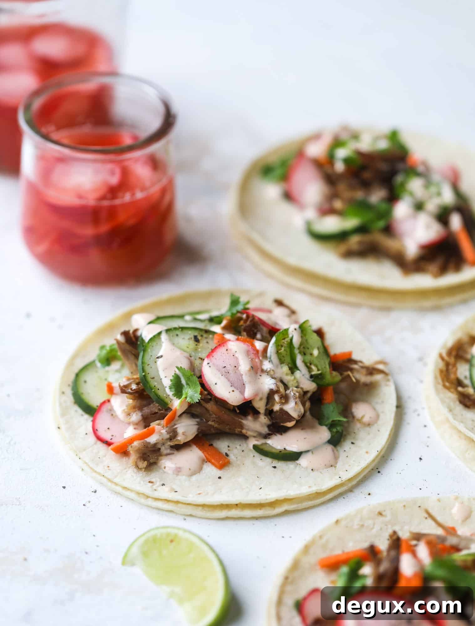 Banh Mi Tacos: Vietnamese Sandwich Flavors in Soft Tortillas 8 These bahn mi tacos are the perfect twist on the classic sandwich! Juicy pulled pork, pickled veggies, a tangy crema and loads of flavor. Bahn mi tacos are a delish weeknight meal or also work great if you have pork leftovers! I howsweeteats.com #bahn #mi #tacos #pork #dinner
