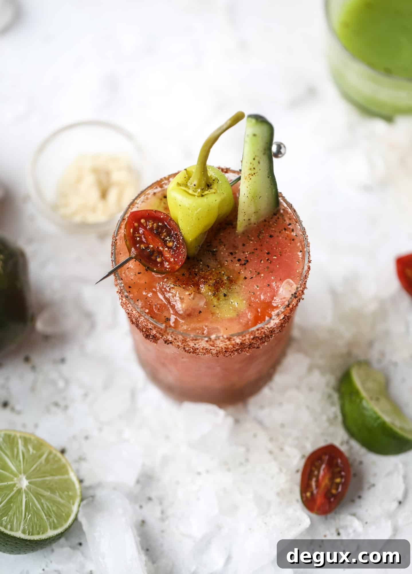Heirloom Tomato Bloody Mary Recipe with Fresh Garden Flavor 2 This bloody mary recipe is made with fresh heirloom tomatoes - the gems of summer! The colors swirl together to create a stunning drinking that is loaded with smoky, spicy flavor. Top with your favorite snacks foe the perfect brunch! I howsweeteats.com #bloody #mary #recipe #best #heirloom #tomatoes #cocktail