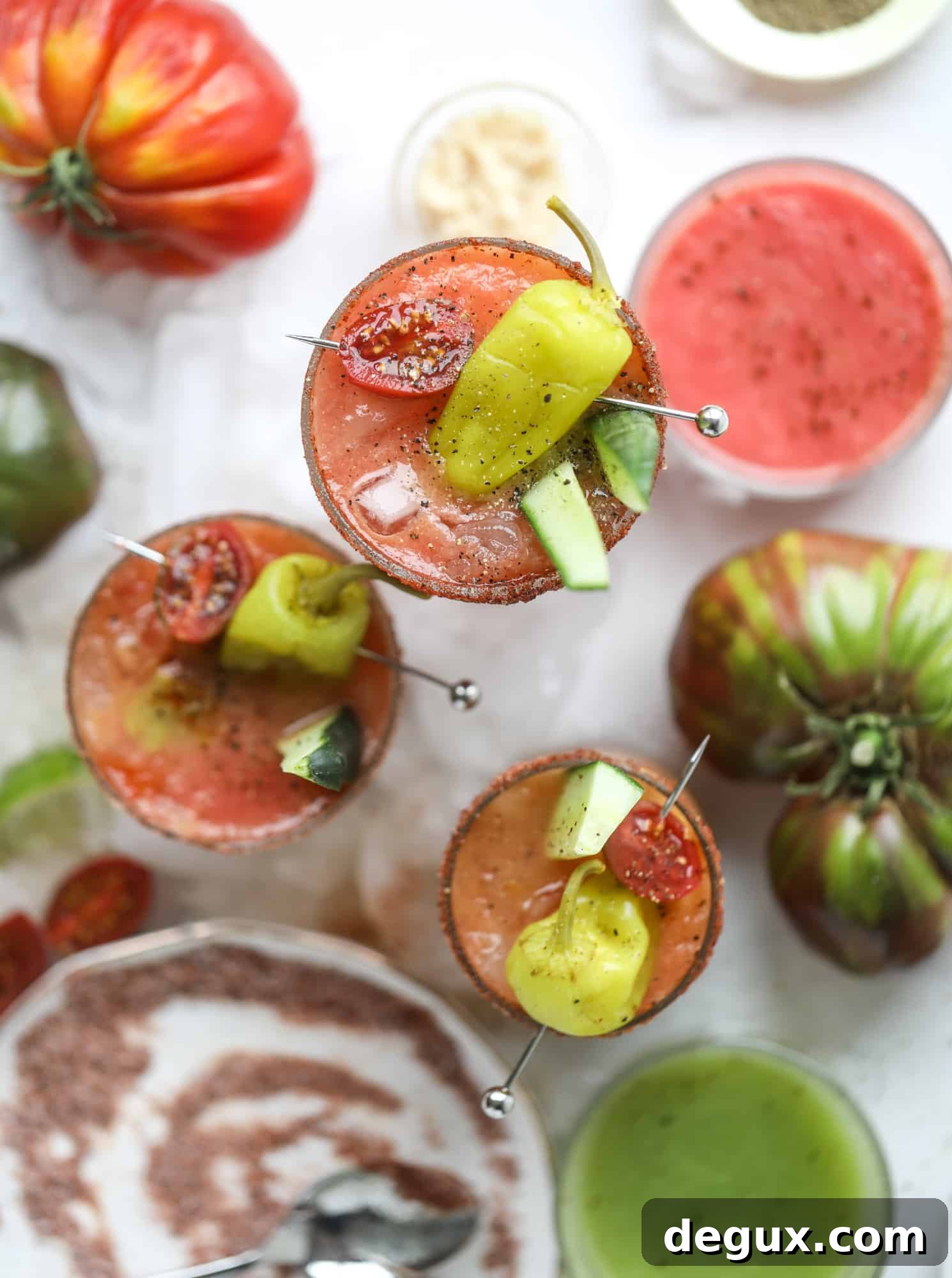 Heirloom Tomato Bloody Mary Recipe with Fresh Garden Flavor 11 This bloody mary recipe is made with fresh heirloom tomatoes - the gems of summer! The colors swirl together to create a stunning drinking that is loaded with smoky, spicy flavor. Top with your favorite snacks foe the perfect brunch! I howsweeteats.com #bloody #mary #recipe #best #heirloom #tomatoes #cocktail