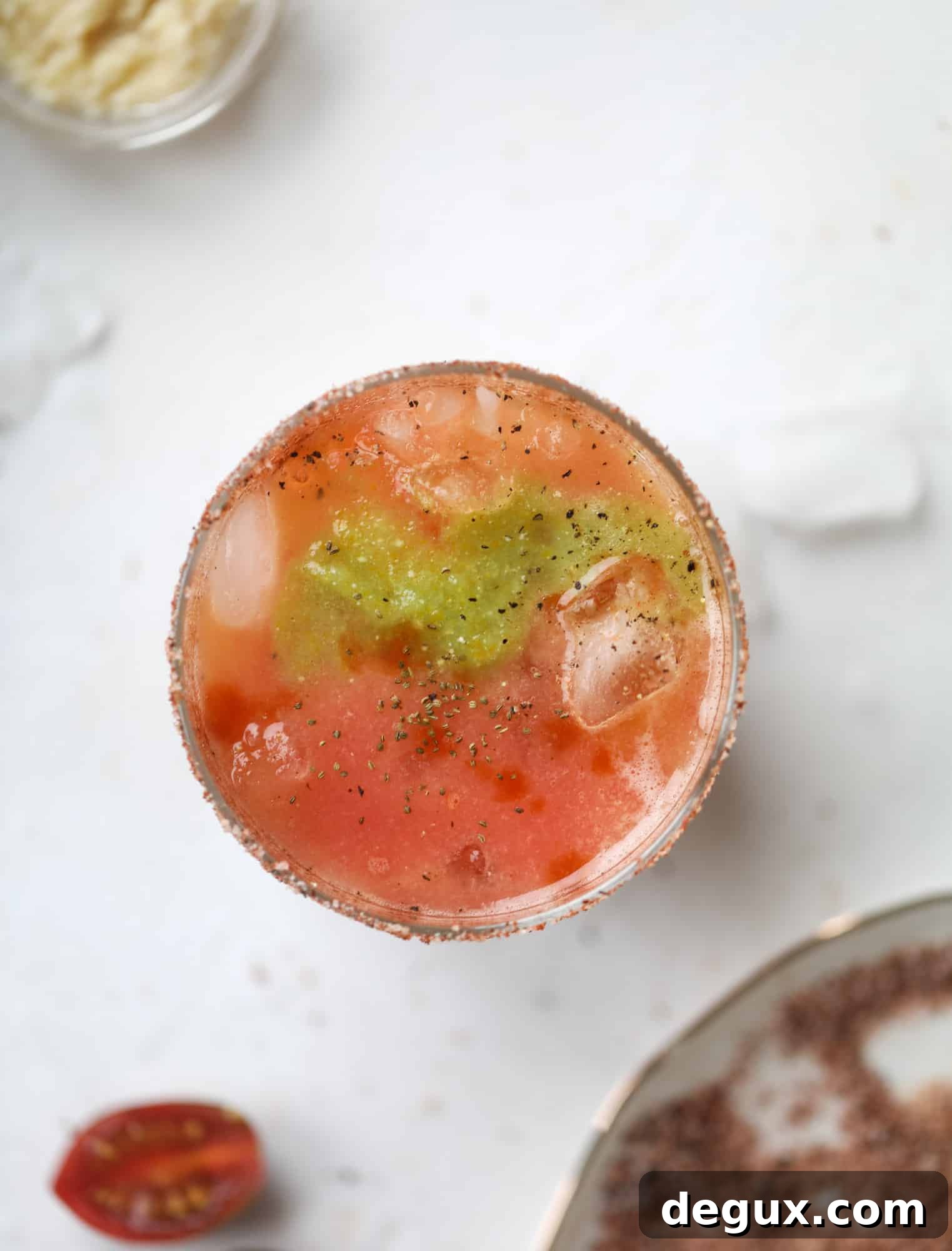 Heirloom Tomato Bloody Mary Recipe with Fresh Garden Flavor 5 This bloody mary recipe is made with fresh heirloom tomatoes - the gems of summer! The colors swirl together to create a stunning drinking that is loaded with smoky, spicy flavor. Top with your favorite snacks foe the perfect brunch! I howsweeteats.com #bloody #mary #recipe #best #heirloom #tomatoes #cocktail