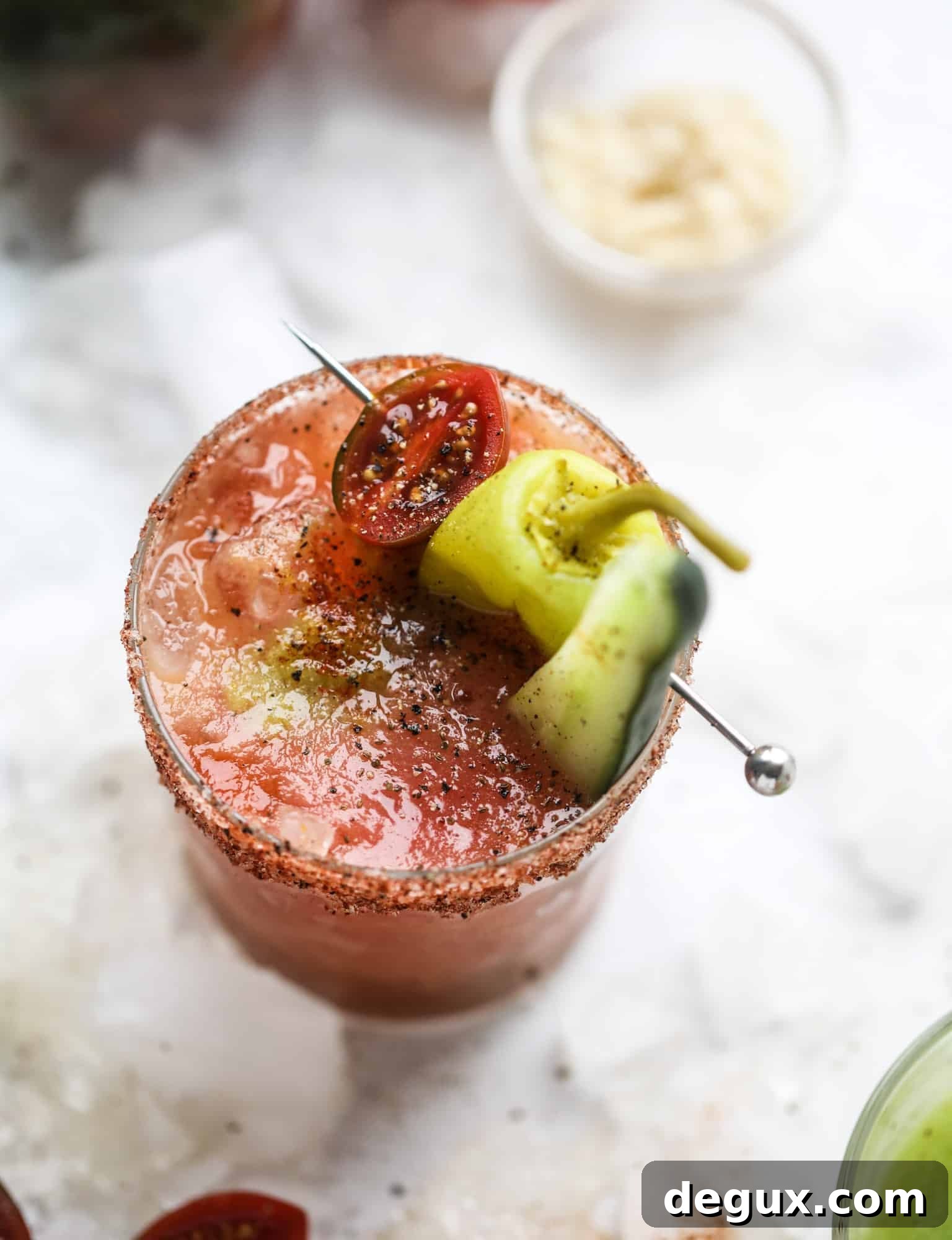Heirloom Tomato Bloody Mary Recipe with Fresh Garden Flavor 8 This bloody mary recipe is made with fresh heirloom tomatoes - the gems of summer! The colors swirl together to create a stunning drinking that is loaded with smoky, spicy flavor. Top with your favorite snacks foe the perfect brunch! I howsweeteats.com #bloody #mary #recipe #best #heirloom #tomatoes #cocktail