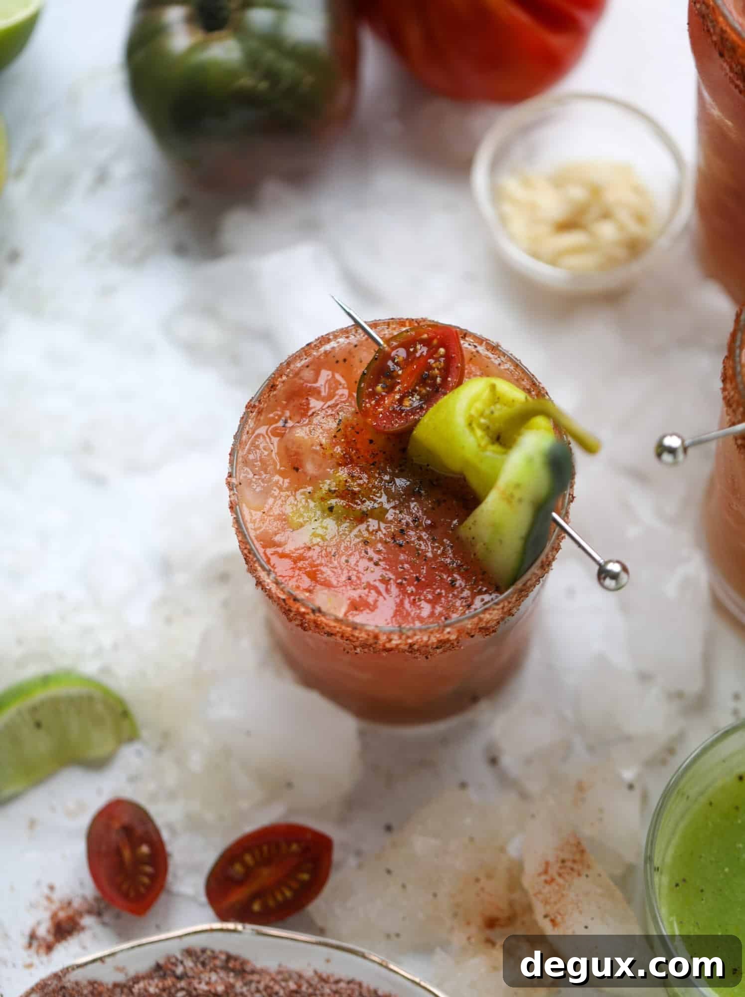 Heirloom Tomato Bloody Mary Recipe with Fresh Garden Flavor 9 This bloody mary recipe is made with fresh heirloom tomatoes - the gems of summer! The colors swirl together to create a stunning drinking that is loaded with smoky, spicy flavor. Top with your favorite snacks foe the perfect brunch! I howsweeteats.com #bloody #mary #recipe #best #heirloom #tomatoes #cocktail