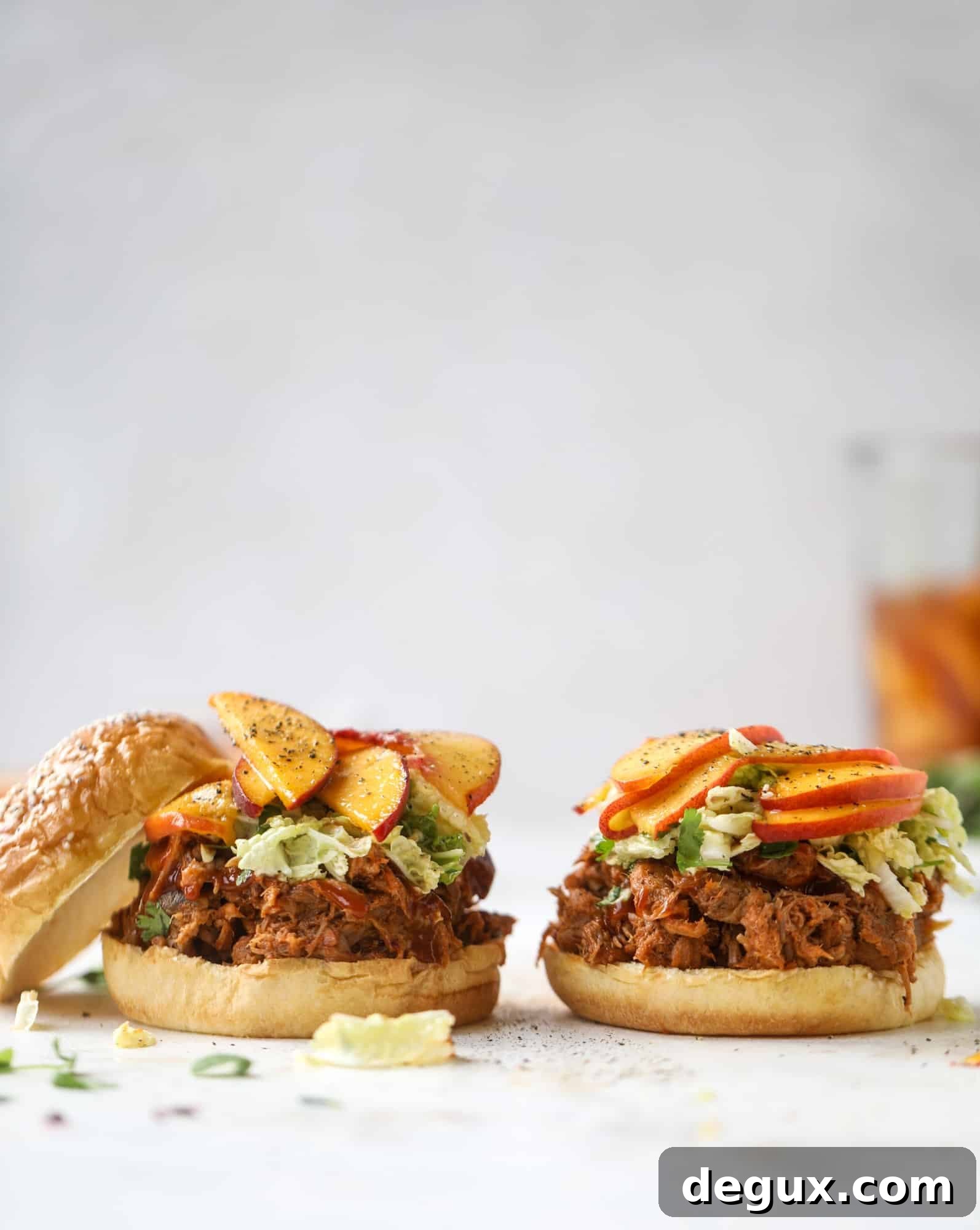 Chipotle Pulled Pork with Tangy Pickled Peaches Recipe 5 This chipotle pulled pork sandwich is spicy, sweet and saucy. Throw it on a bun or a plate and top it with the most delicious quick pickled peaches and napa cabbage slaw. Flavor and texture make this sandwich incredible! I howsweeteats.com #pulled #pork #chipotle #pickled #peaches #slaw #sandwiches #slow #cooker