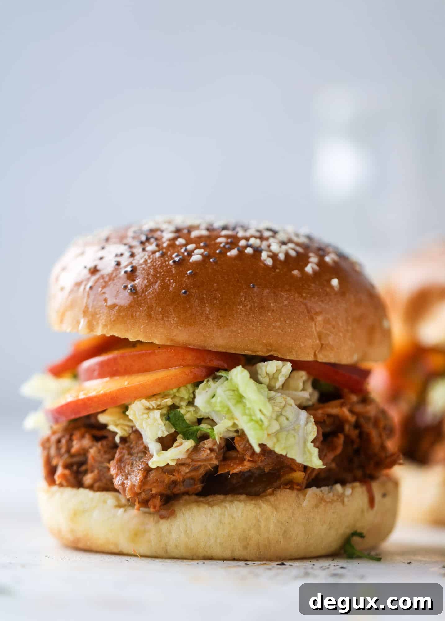 Chipotle Pulled Pork with Tangy Pickled Peaches Recipe 9 This chipotle pulled pork sandwich is spicy, sweet and saucy. Throw it on a bun or a plate and top it with the most delicious quick pickled peaches and napa cabbage slaw. Flavor and texture make this sandwich incredible! I howsweeteats.com #pulled #pork #chipotle #pickled #peaches #slaw #sandwiches #slow #cooker