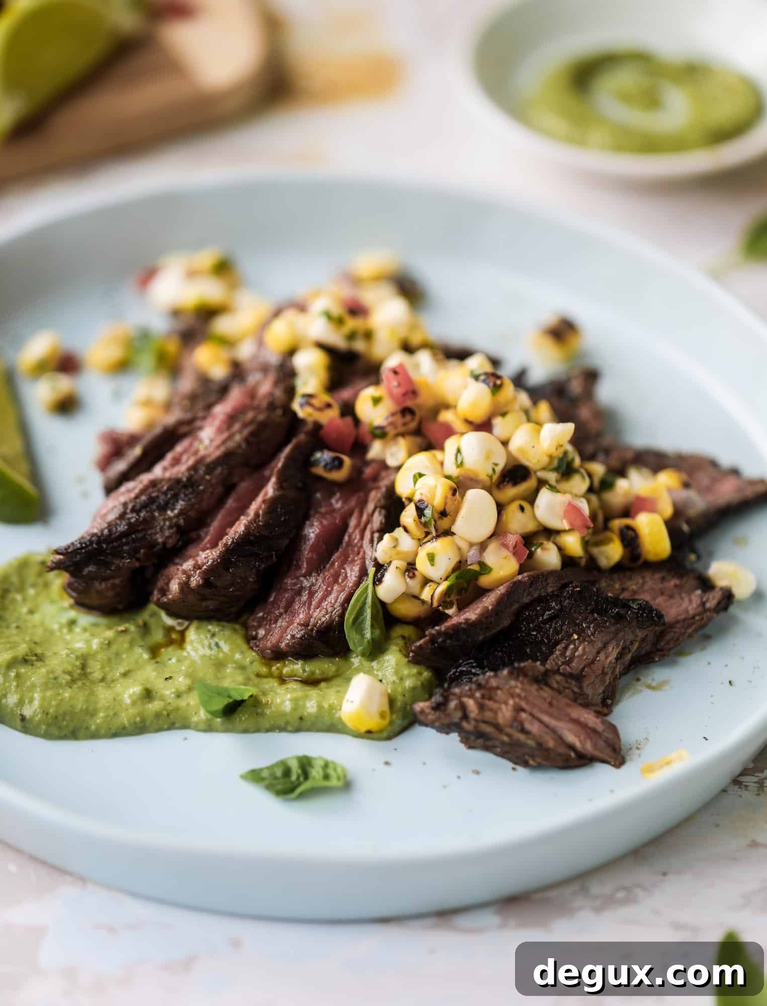 This skirt steak recipe is so super easy and delicious! Marinate it for a bit, prepare it to your liking then serve it with the most flavorful avocado pesto and grilled corn relish. Feels like a fancy restaurant meal and will make you love skirt steak forever! I howsweeteats.com #skirt #steak #avocado #pesto #corn #relish #recipes