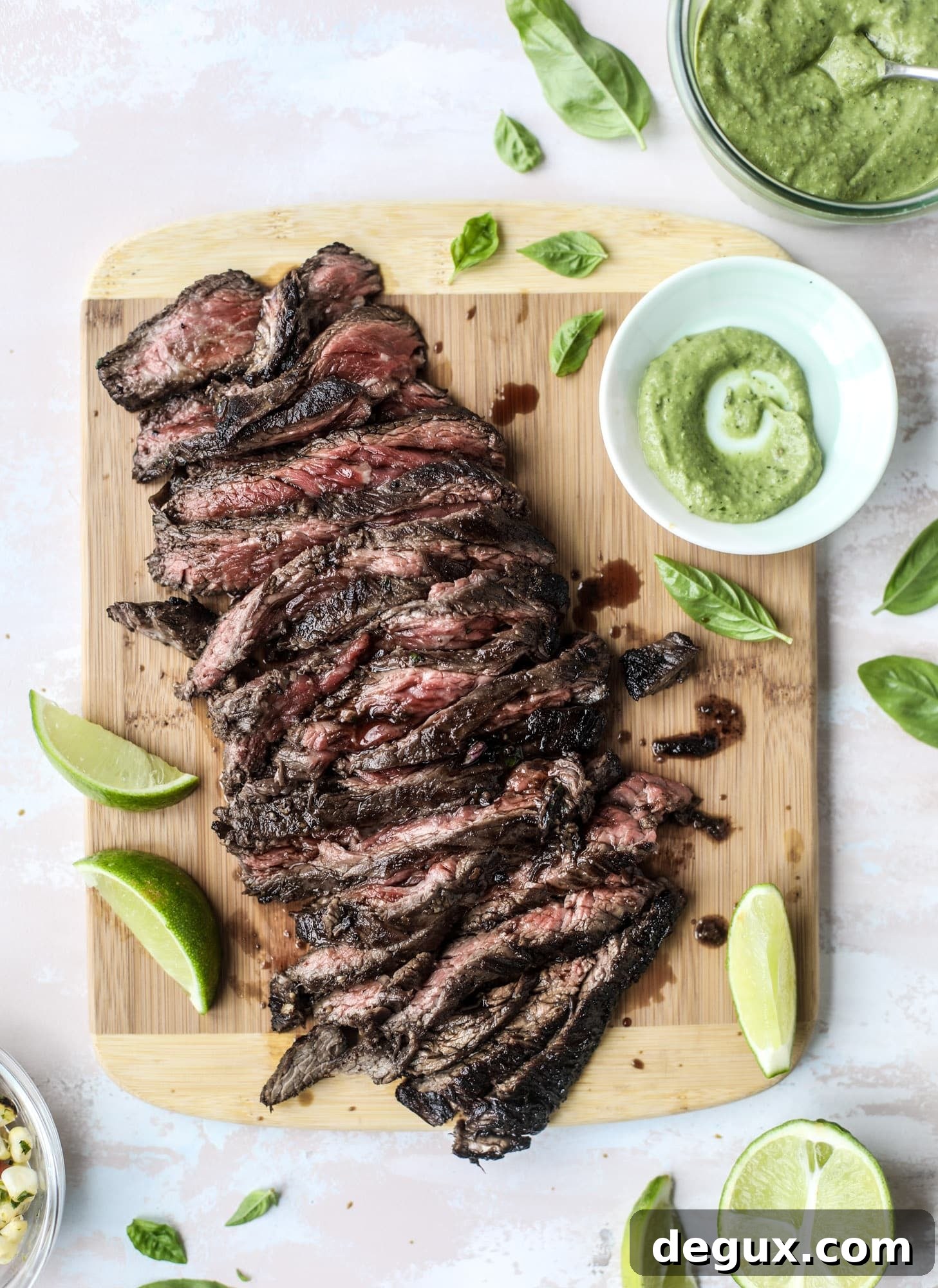 This skirt steak recipe is so super easy and delicious! Marinate it for a bit, prepare it to your liking then serve it with the most flavorful avocado pesto and grilled corn relish. Feels like a fancy restaurant meal and will make you love skirt steak forever! I howsweeteats.com #skirt #steak #avocado #pesto #corn #relish #recipes