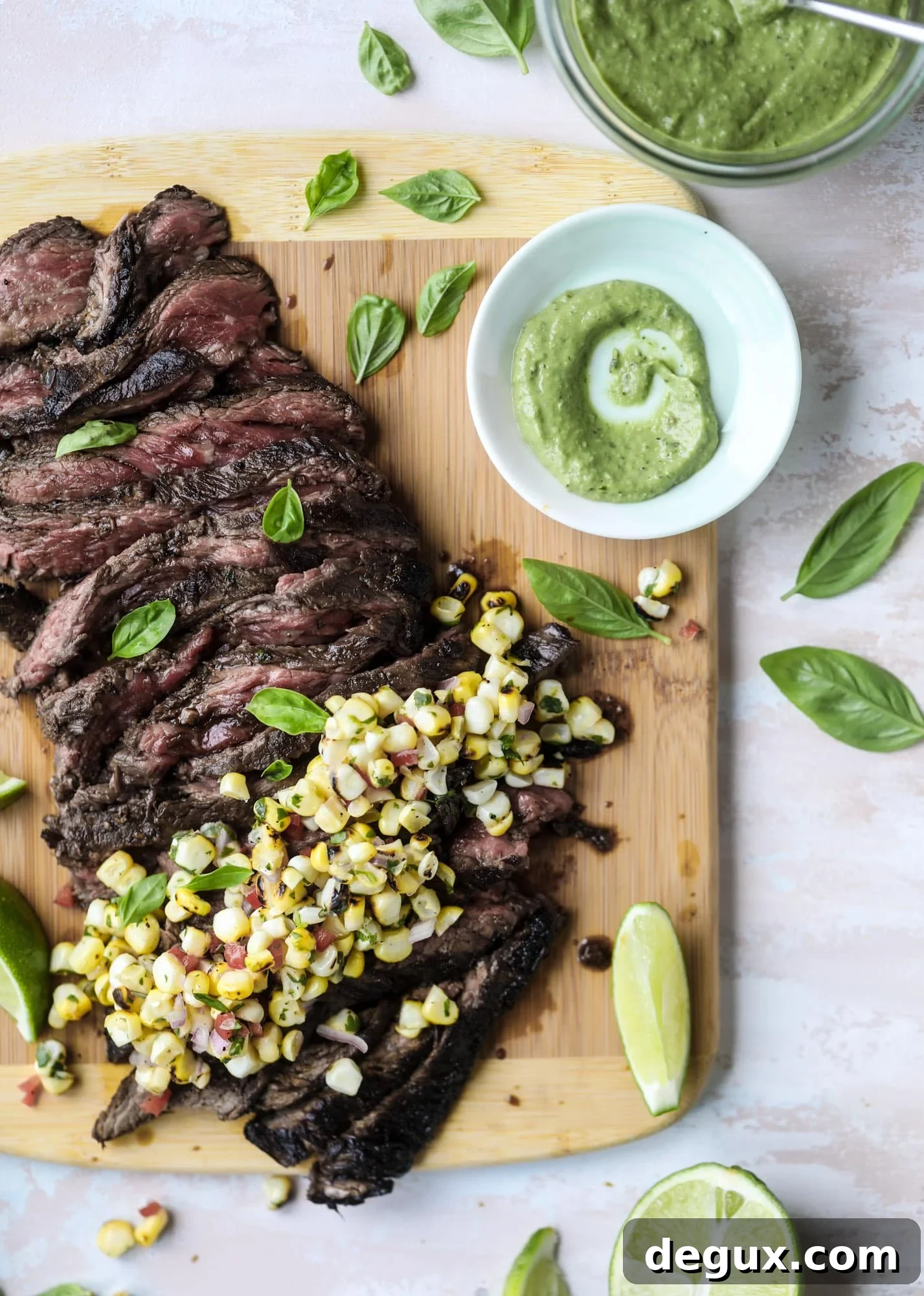 This skirt steak recipe is so super easy and delicious! Marinate it for a bit, prepare it to your liking then serve it with the most flavorful avocado pesto and grilled corn relish. Feels like a fancy restaurant meal and will make you love skirt steak forever! I howsweeteats.com #skirt #steak #avocado #pesto #corn #relish #recipes