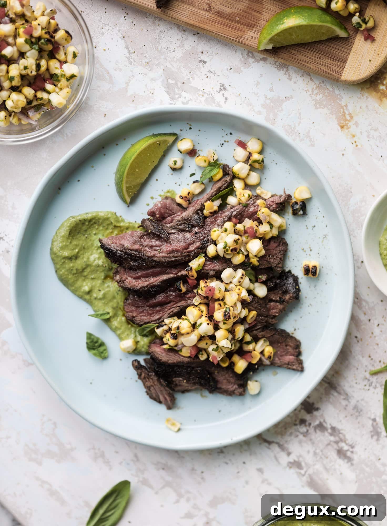 This skirt steak recipe is so super easy and delicious! Marinate it for a bit, prepare it to your liking then serve it with the most flavorful avocado pesto and grilled corn relish. Feels like a fancy restaurant meal and will make you love skirt steak forever! I howsweeteats.com #skirt #steak #avocado #pesto #corn #relish #recipes
