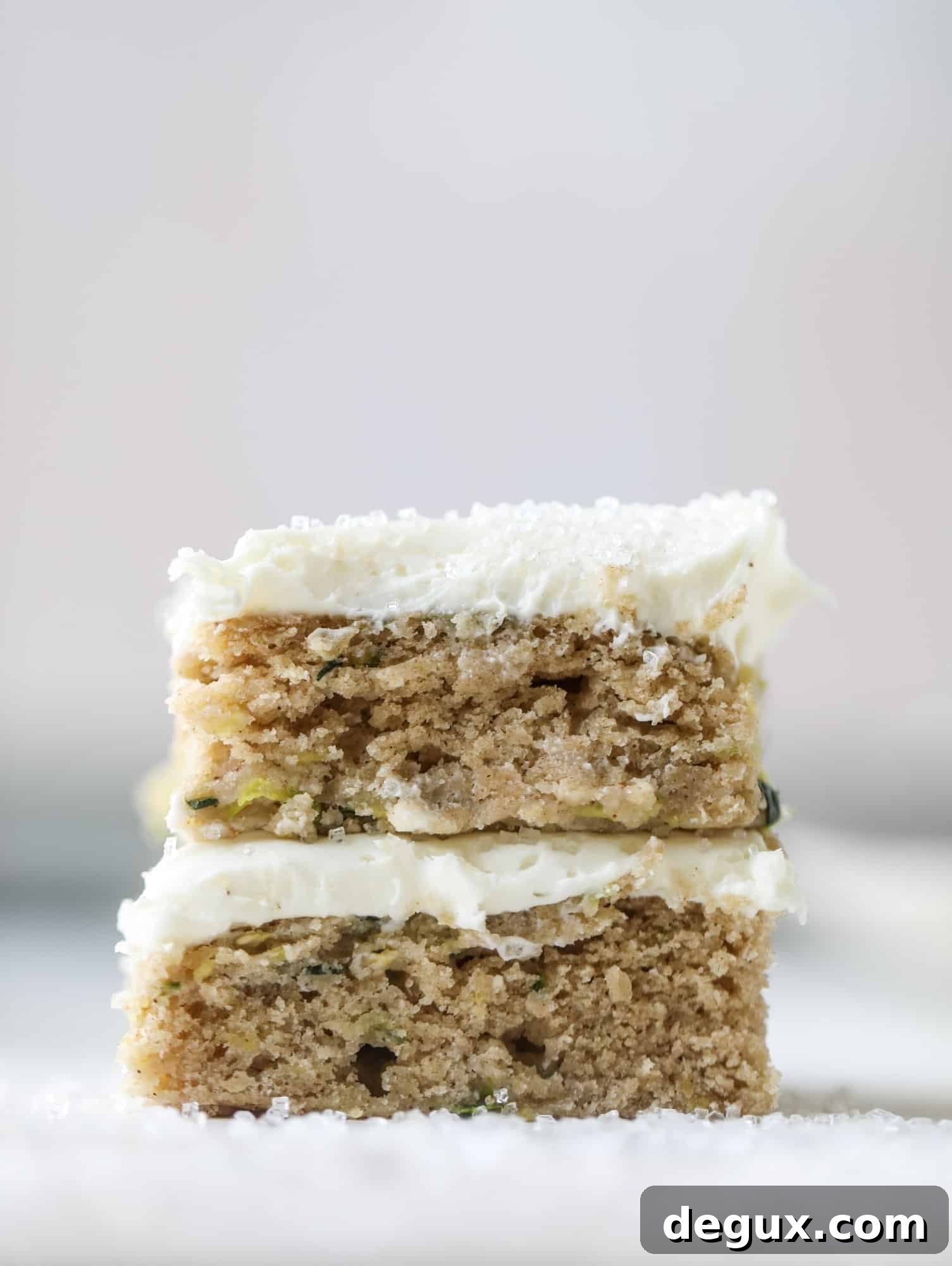 Zucchini Bars with Cream Cheese Frosting — Moist Spring Dessert 2 These zucchini bars with cream cheese icing are a fun twist on zucchini bread! Zucchini bars are super easy to make, have a little spice and a lot of flavor, topped with the creamiest cream cheese frosting. Delicious and simple! I howsweeteats.com #zucchini #bars #cream #cheese #icing #dessert