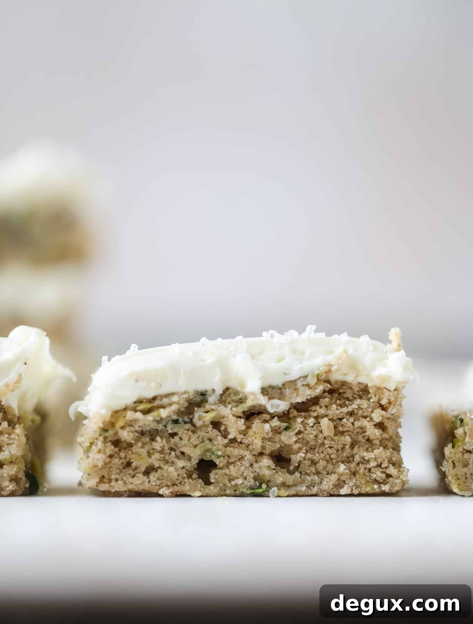 Zucchini Bars with Cream Cheese Frosting — Moist Spring Dessert 7 These zucchini bars with cream cheese icing are a fun twist on zucchini bread! Zucchini bars are super easy to make, have a little spice and a lot of flavor, topped with the creamiest cream cheese frosting. Delicious and simple! I howsweeteats.com #zucchini #bars #cream #cheese #icing #dessert