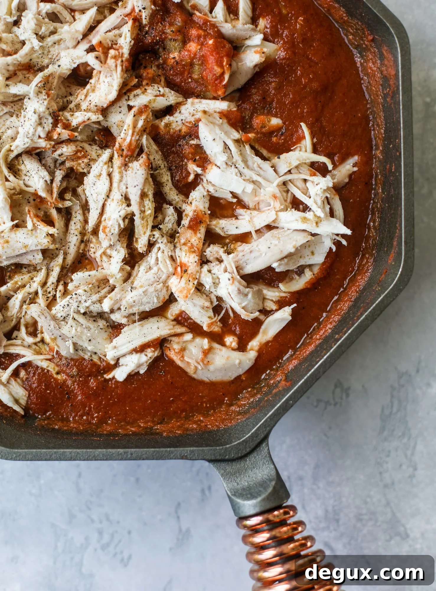 20-Minute Fire-Roasted Chicken Chilaquiles Recipe 4 This skillet of fire roasted chicken chilaquiles is so easy, flavorful and delicious! A quick blender sauce made with fire roasted tomatoes, shredded chicken, lots of tortilla chips and your favorite toppings. Give me all the cheese and guacamole! I howsweeteats.com #chicken #chilaquiles #recipe #easy #dinner