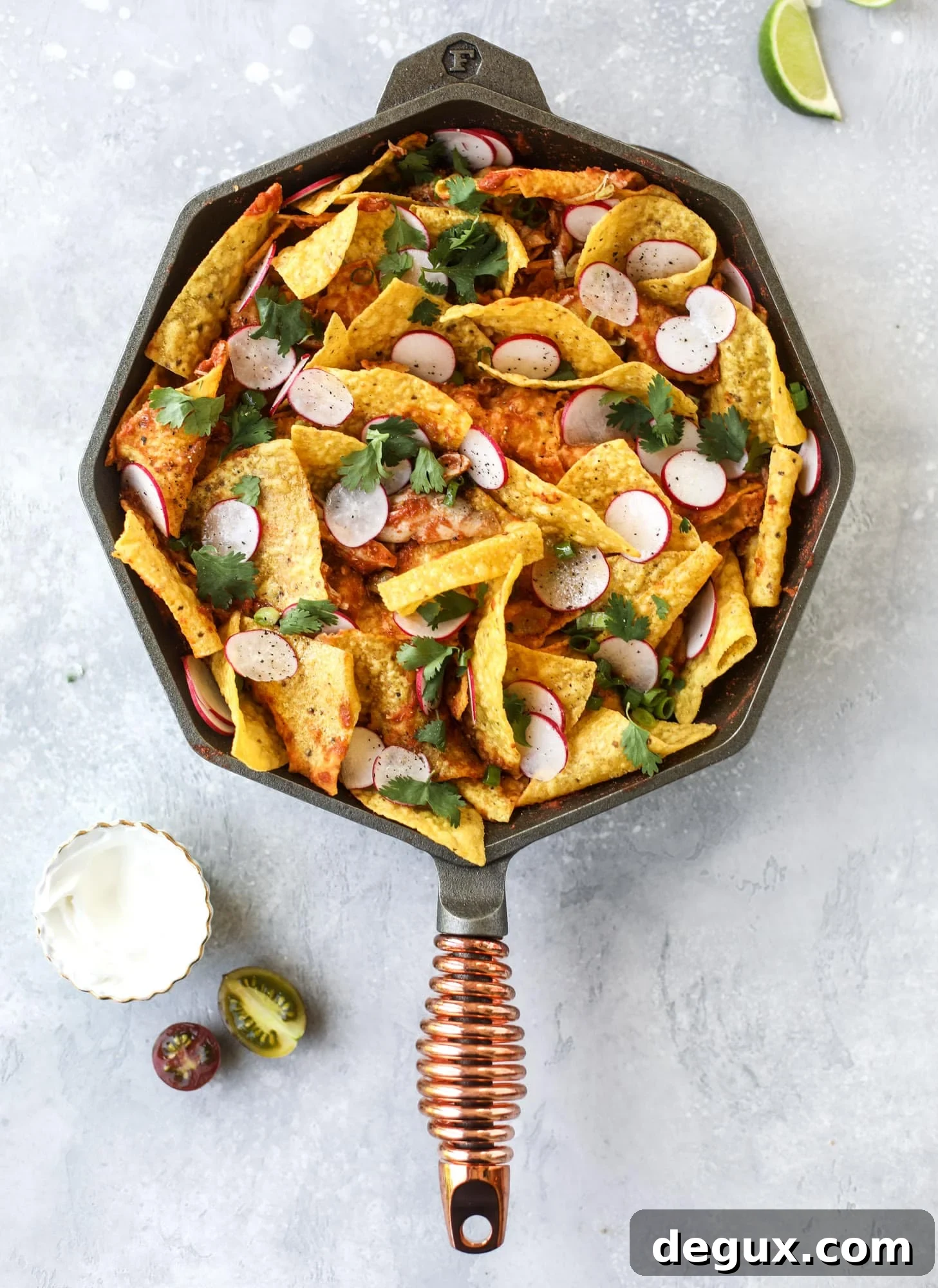 20-Minute Fire-Roasted Chicken Chilaquiles Recipe 5 This skillet of fire roasted chicken chilaquiles is so easy, flavorful and delicious! A quick blender sauce made with fire roasted tomatoes, shredded chicken, lots of tortilla chips and your favorite toppings. Give me all the cheese and guacamole! I howsweeteats.com #chicken #chilaquiles #recipe #easy #dinner